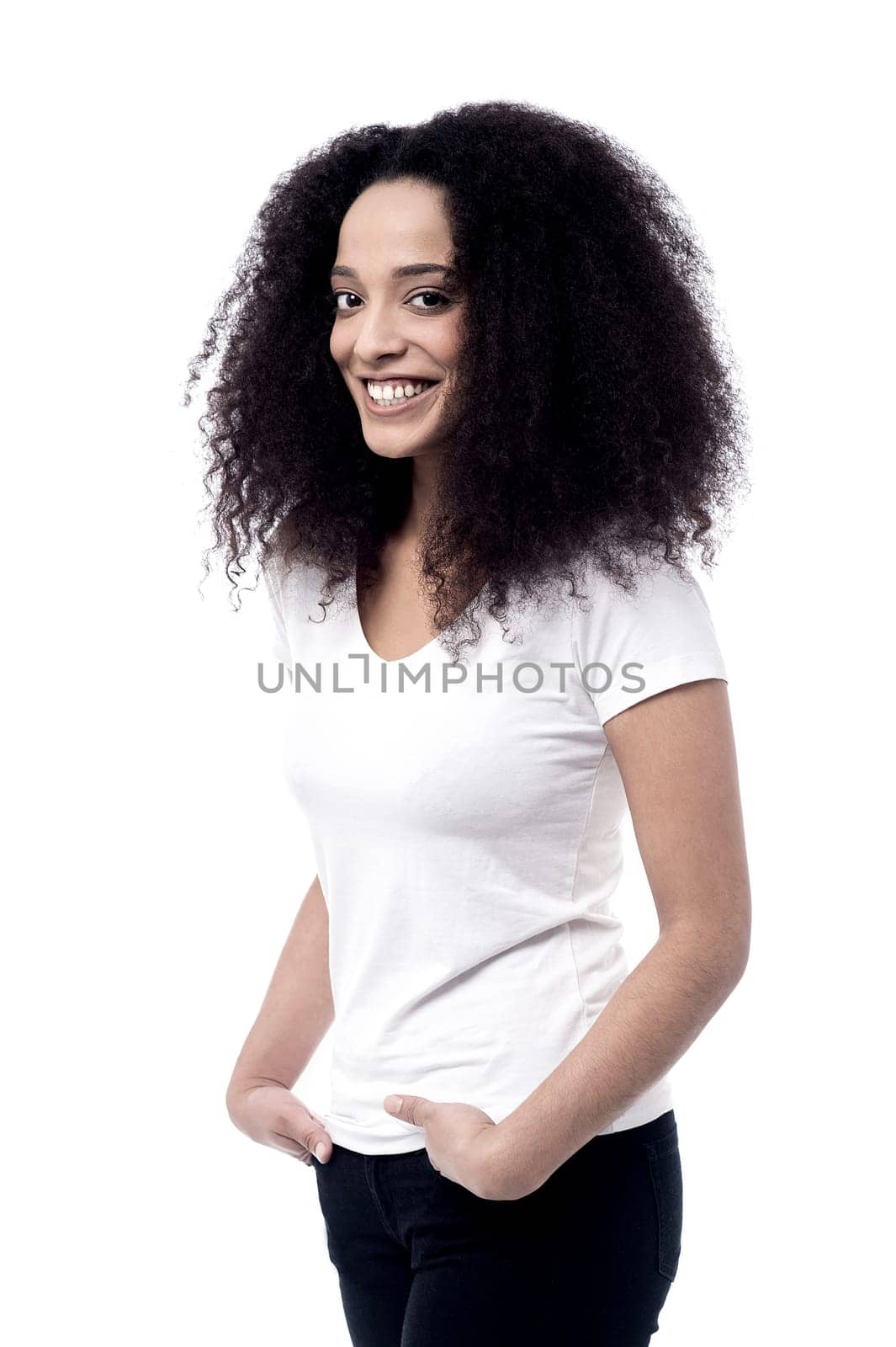 Pretty woman posing with hands in pockets