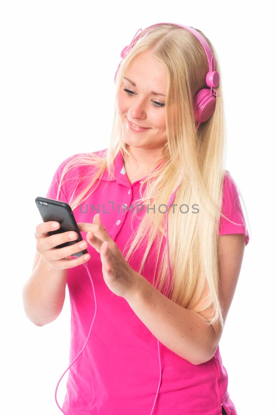 Girl with headphones and mobile phone selects music