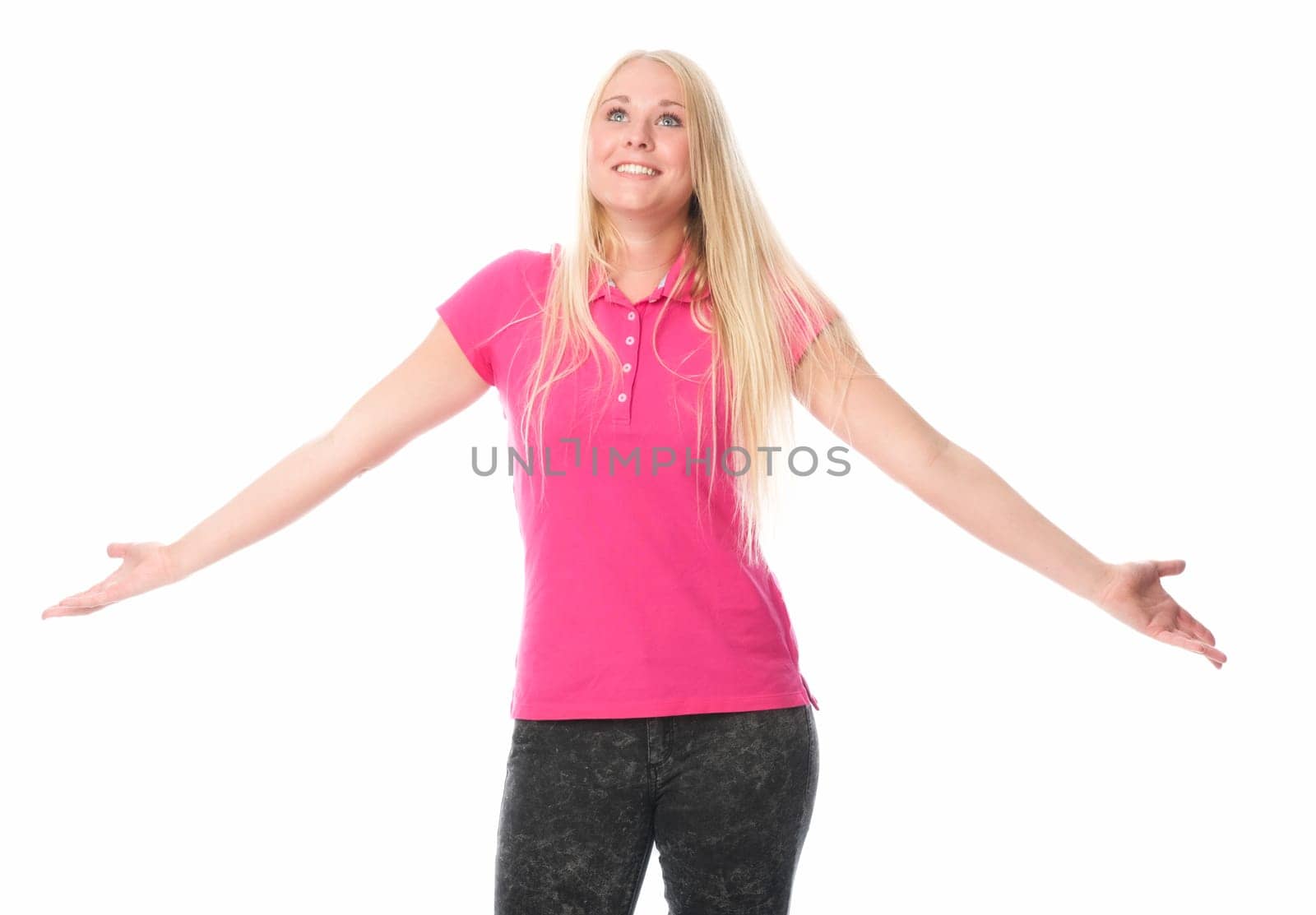 Young woman raises her arms with happiness
