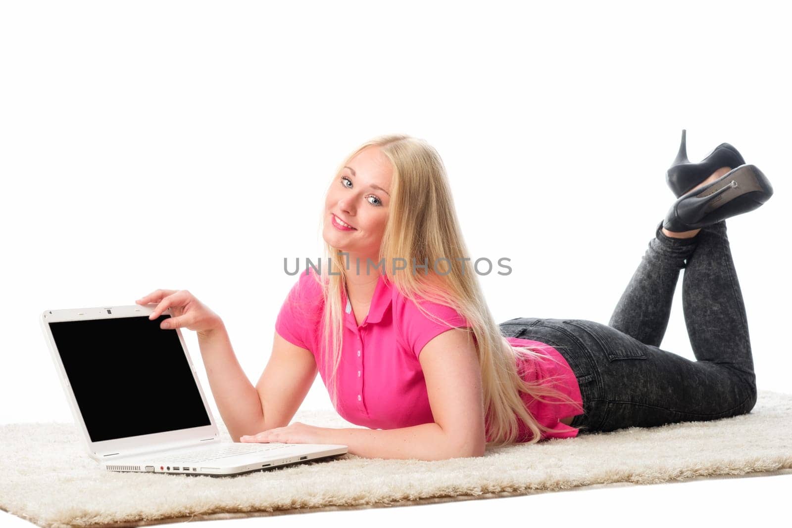 Girl lies on the floor with laptop
