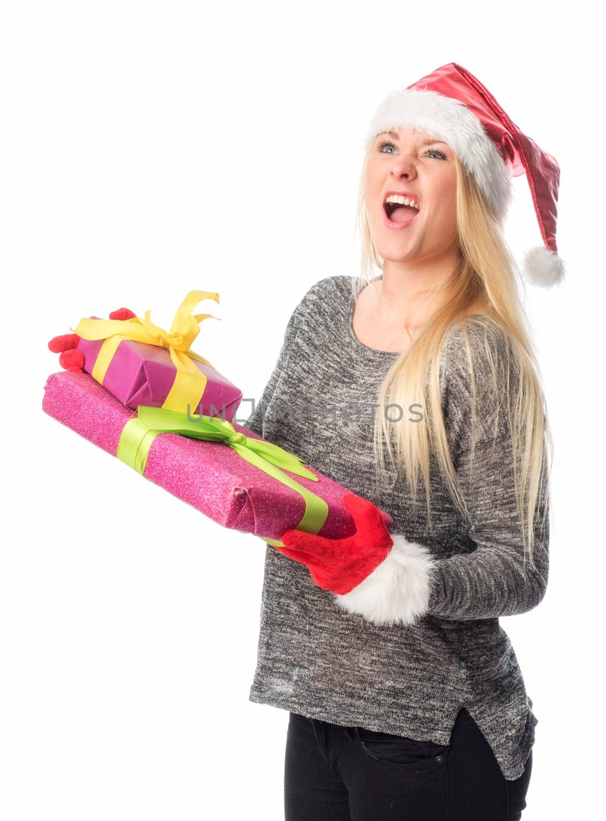 Christmas woman holds a gift and screams