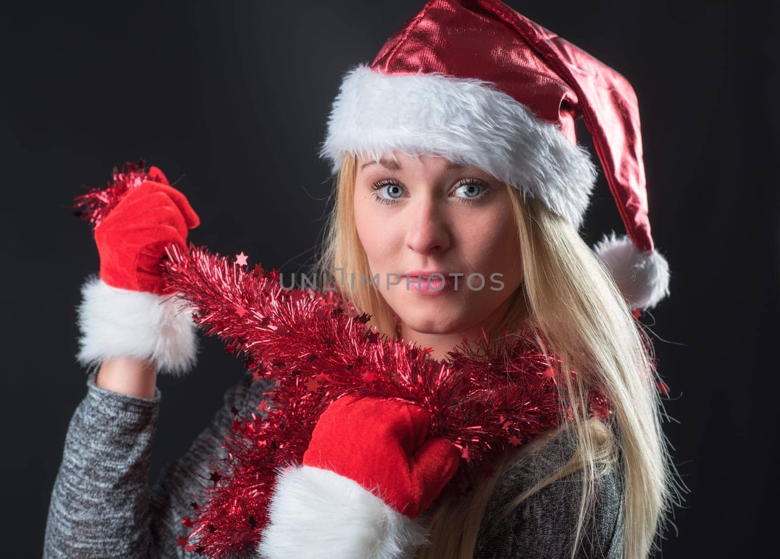 Christmas woman wears lametta around her neck