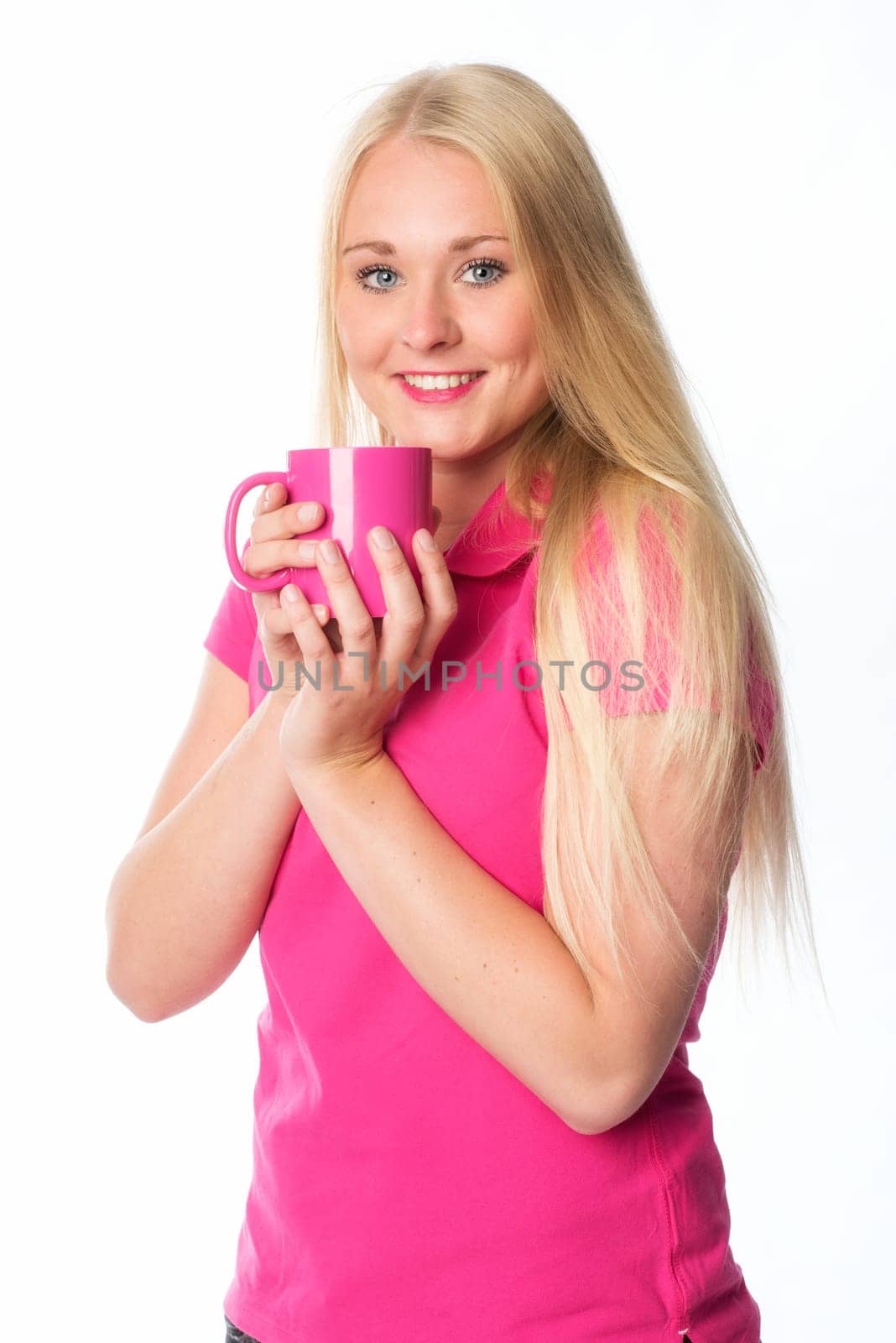 Blonde woman holds a coffee mug