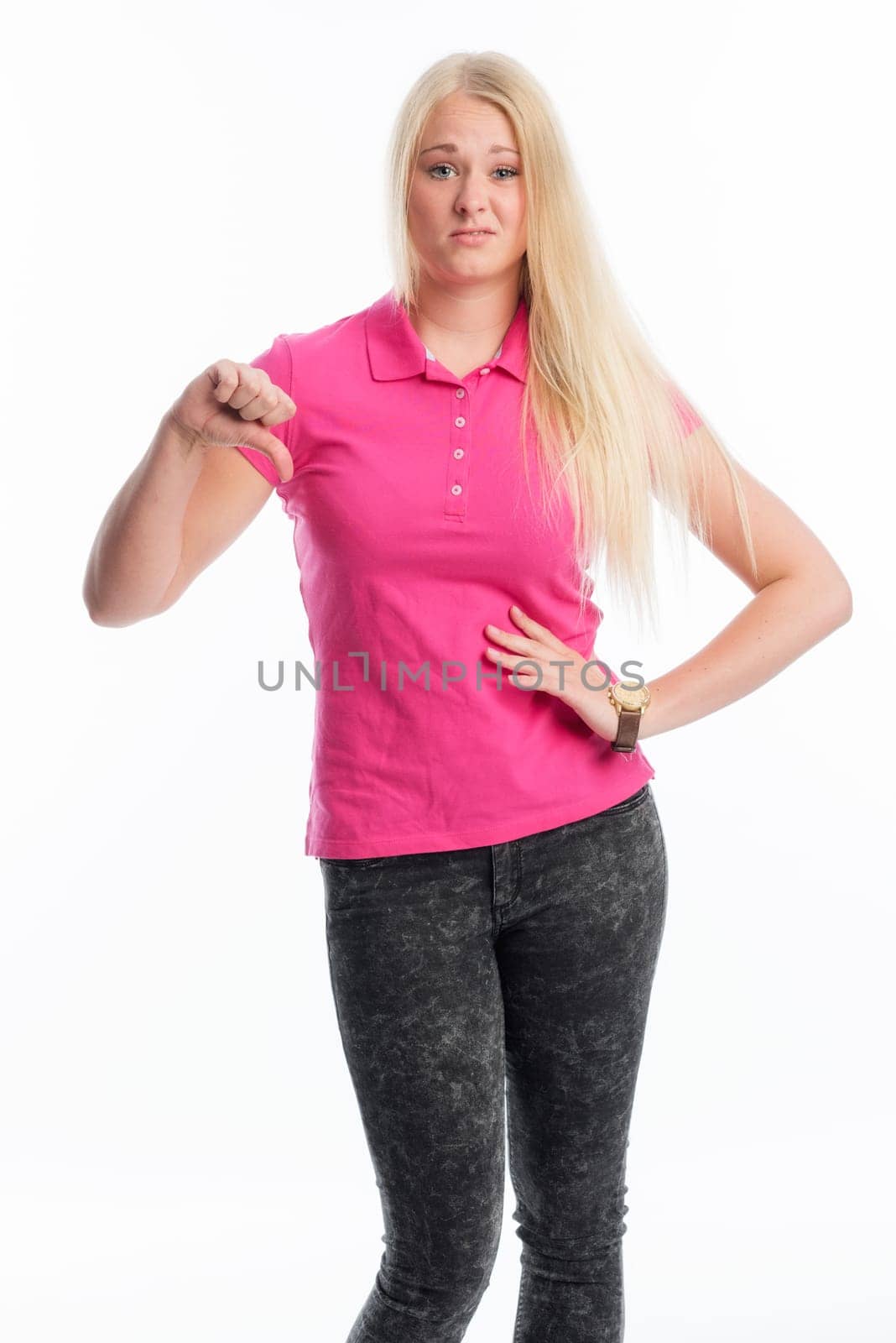 Blonde woman shows off her thumbs down