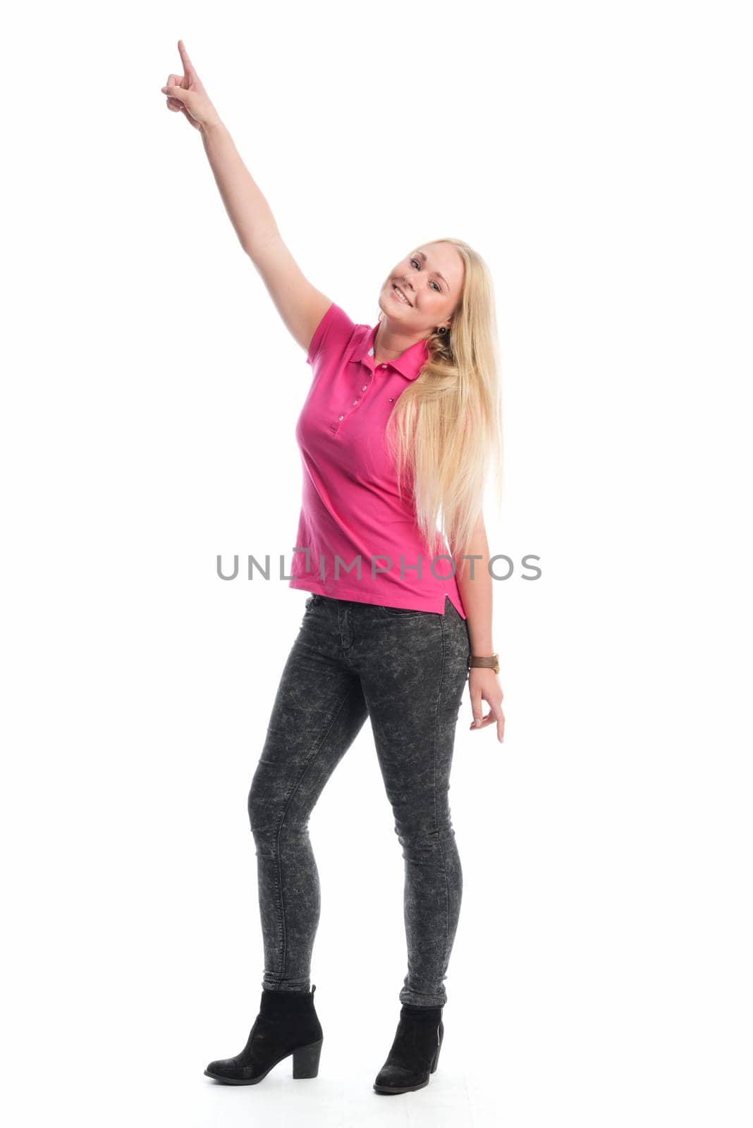 Young blonde woman points her finger up
