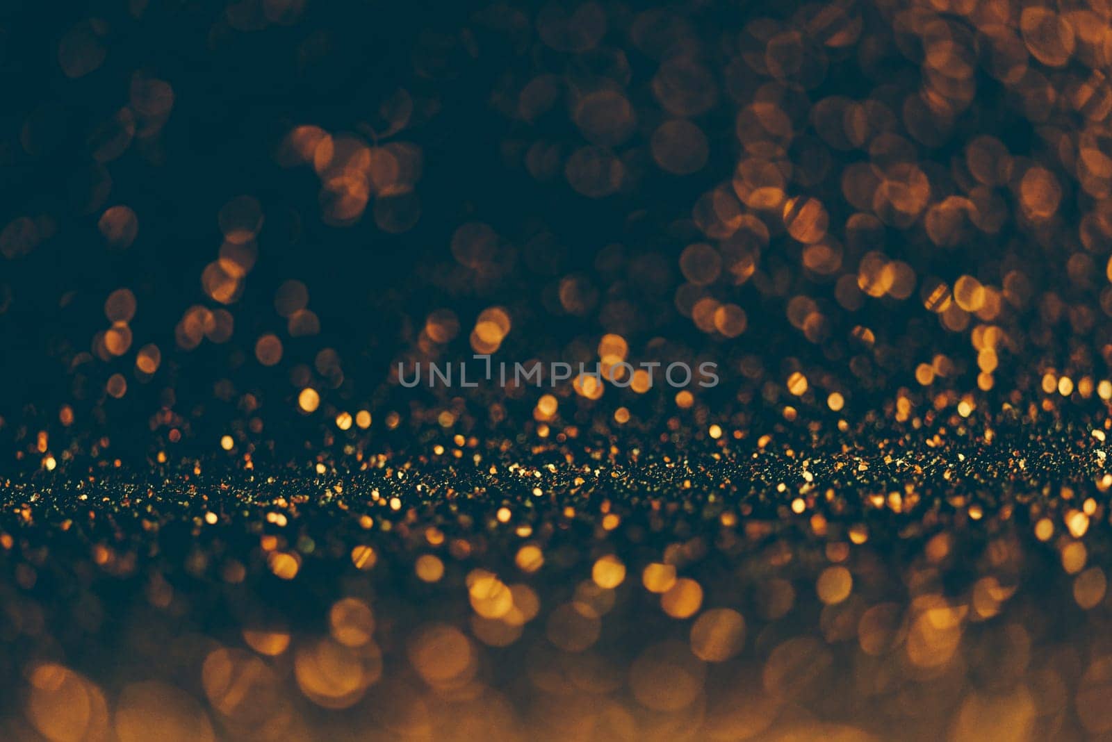 Blur neon gold and blue light circle background. Sparkling firework bokeh dots in vintage style. Luxury and classy new year and christmas celebration party textured dark backdrop. Blurry golden dust.