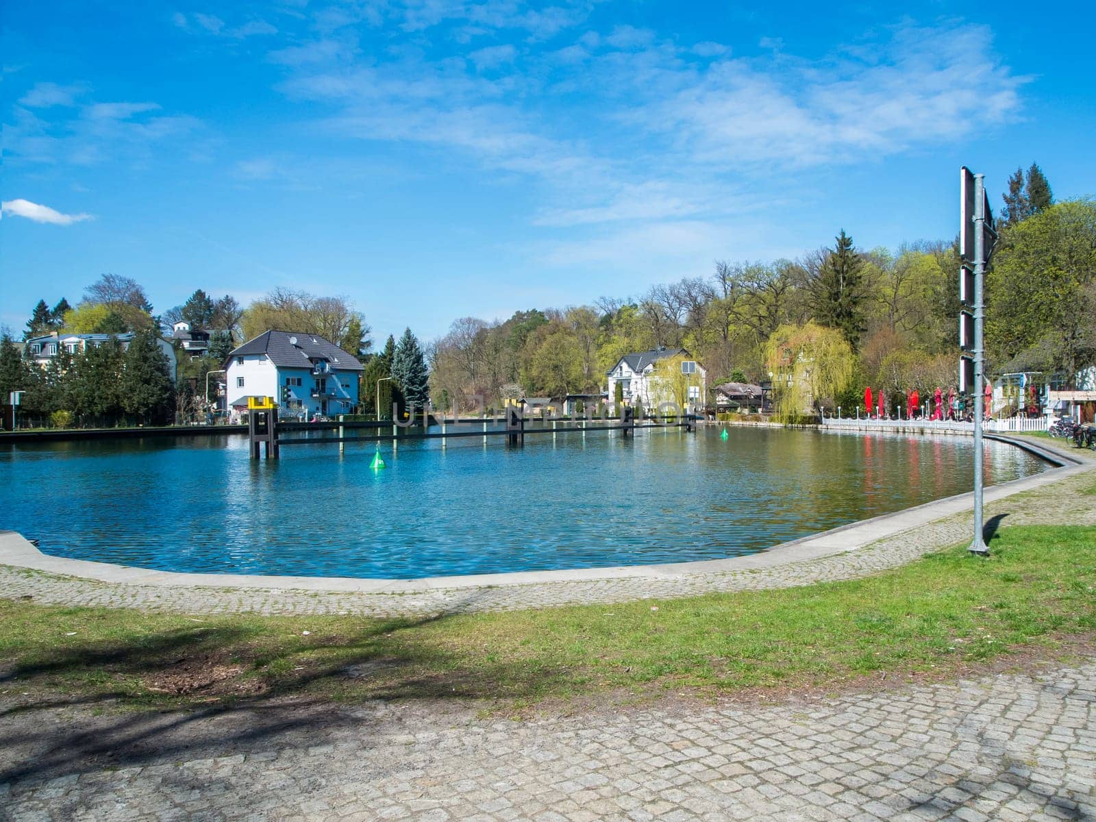 Woltersdorf, Germany - April 17, 2022: Jetty basin with adjacent tourist restaurants at the Woltersdorfer Schleuse in the direction of Kalksee.