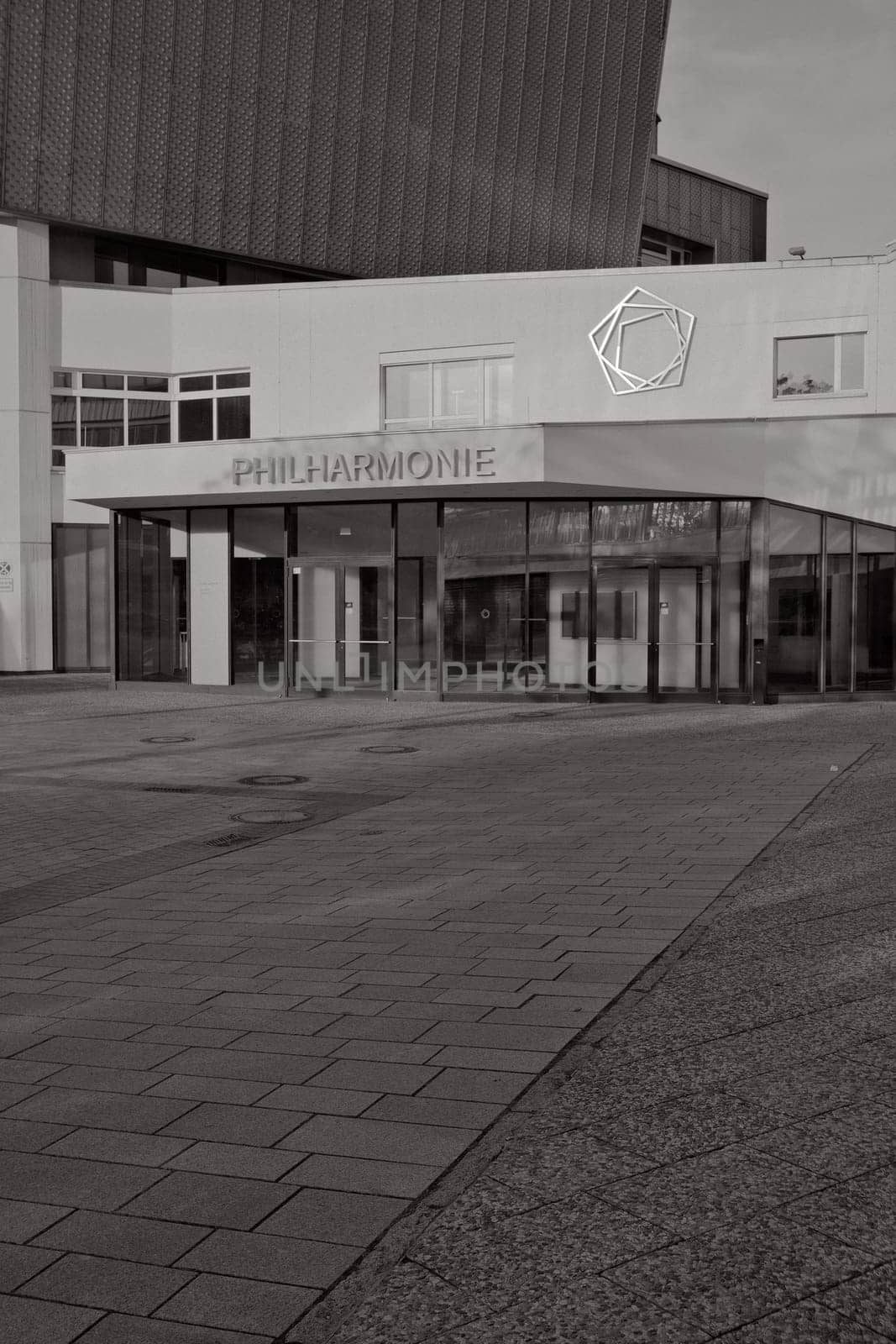 Vertical black and white shot of the entrance of the Berlin Philharmonic Hall