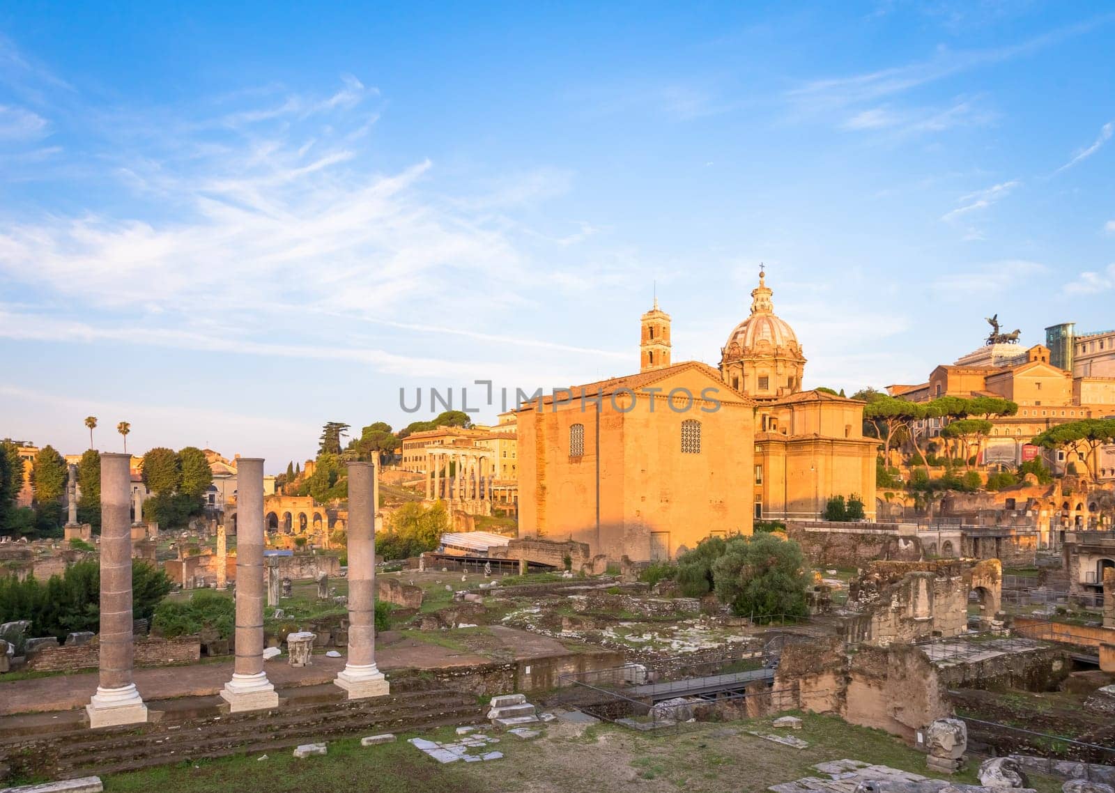 ROME, ITALY - CIRCA AUGUST 2020: sunrise light with blue sky on Roman ancient architecture.