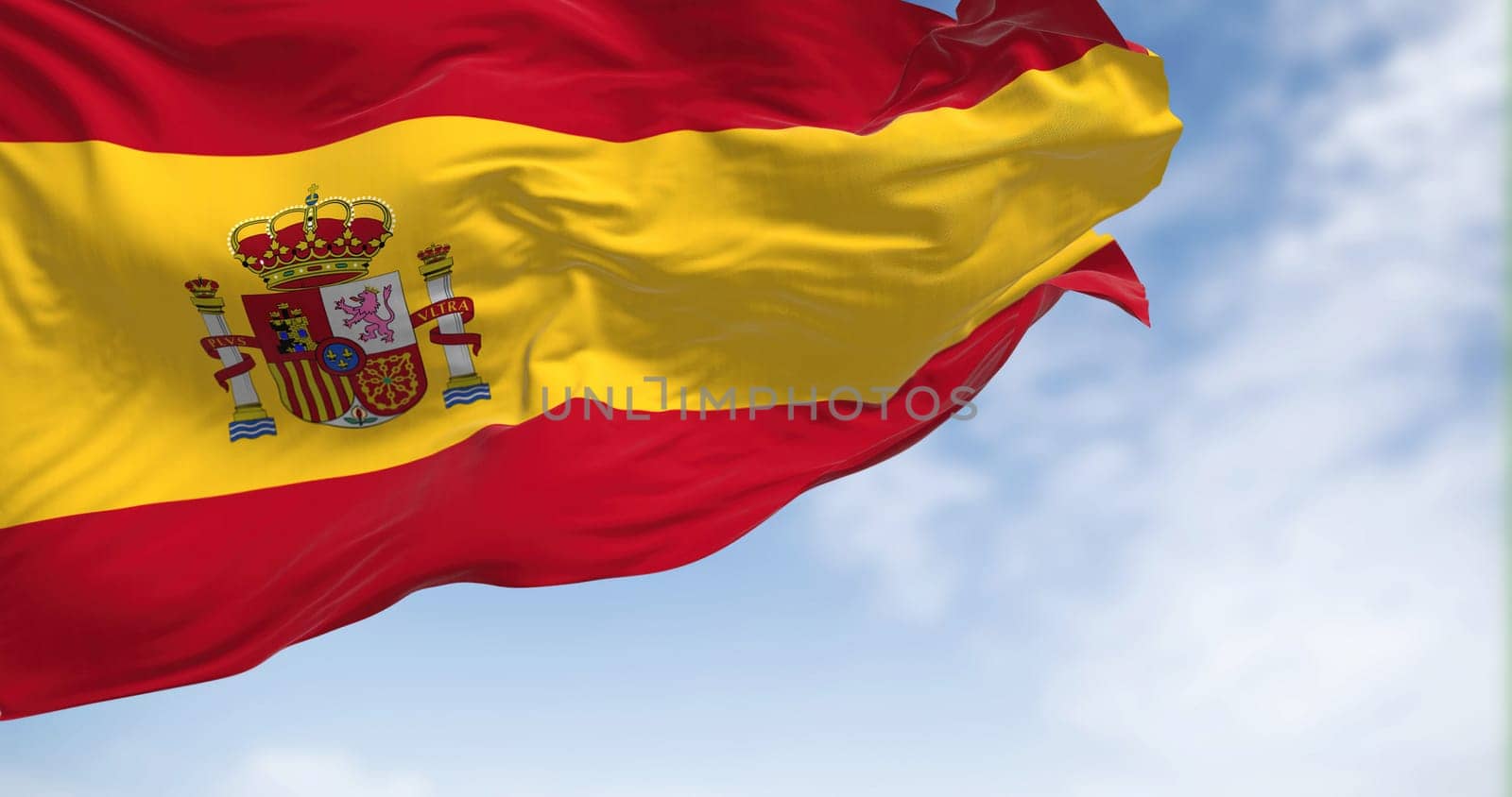 Spain national flag waving on a clear day. Kingdom of Spain is a country located in southwestern Europe. Selective focus. Realistic 3D illustration