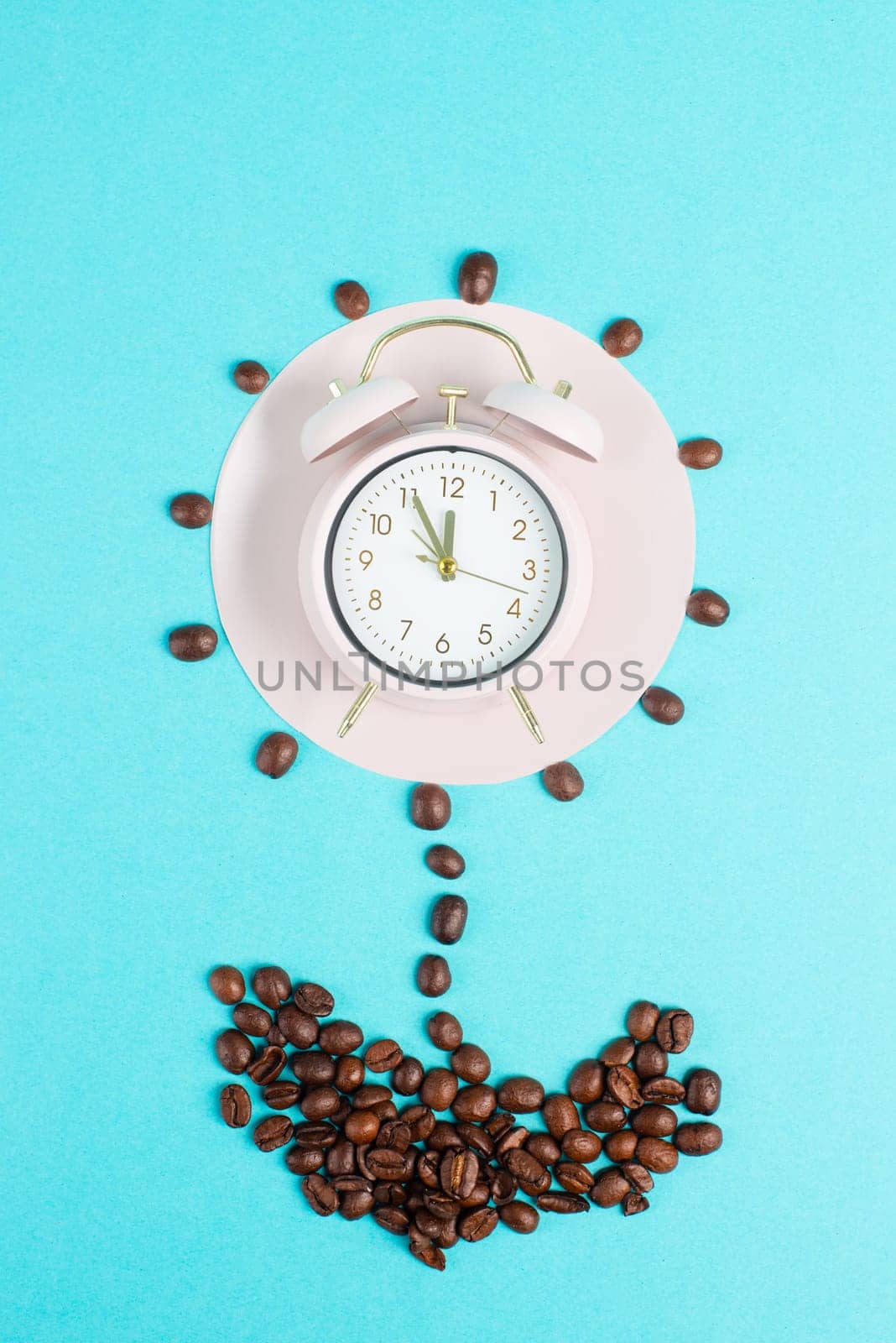 Alarm clock, flower from roasted coffee beans, wake up and have energy from caffeine, time for a break