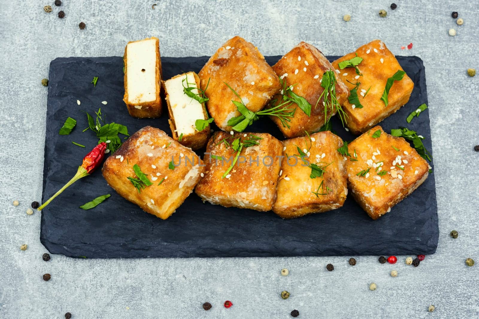 Roasted tofu cheese and sesame seeds,asian vegan food. Tahu Goreng