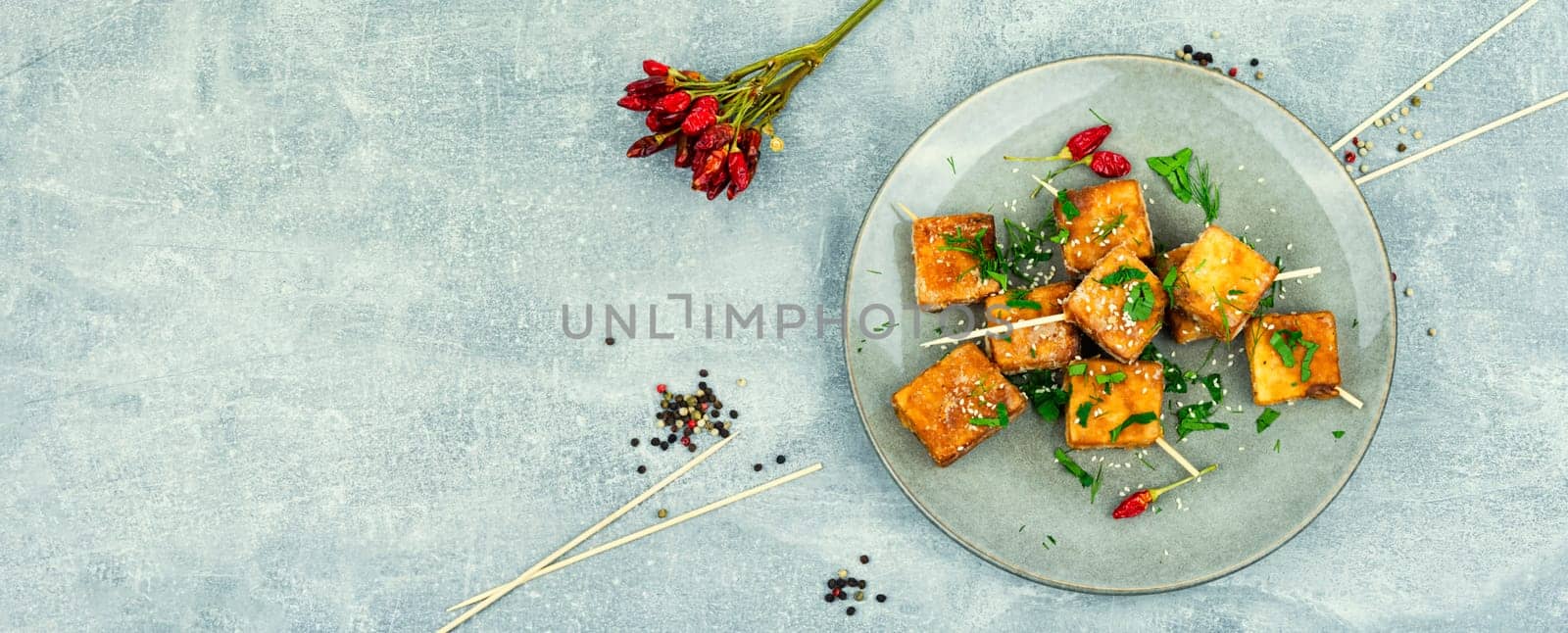 Roasted tofu cheese and sesame seeds,asian vegan food. Tahu Goreng