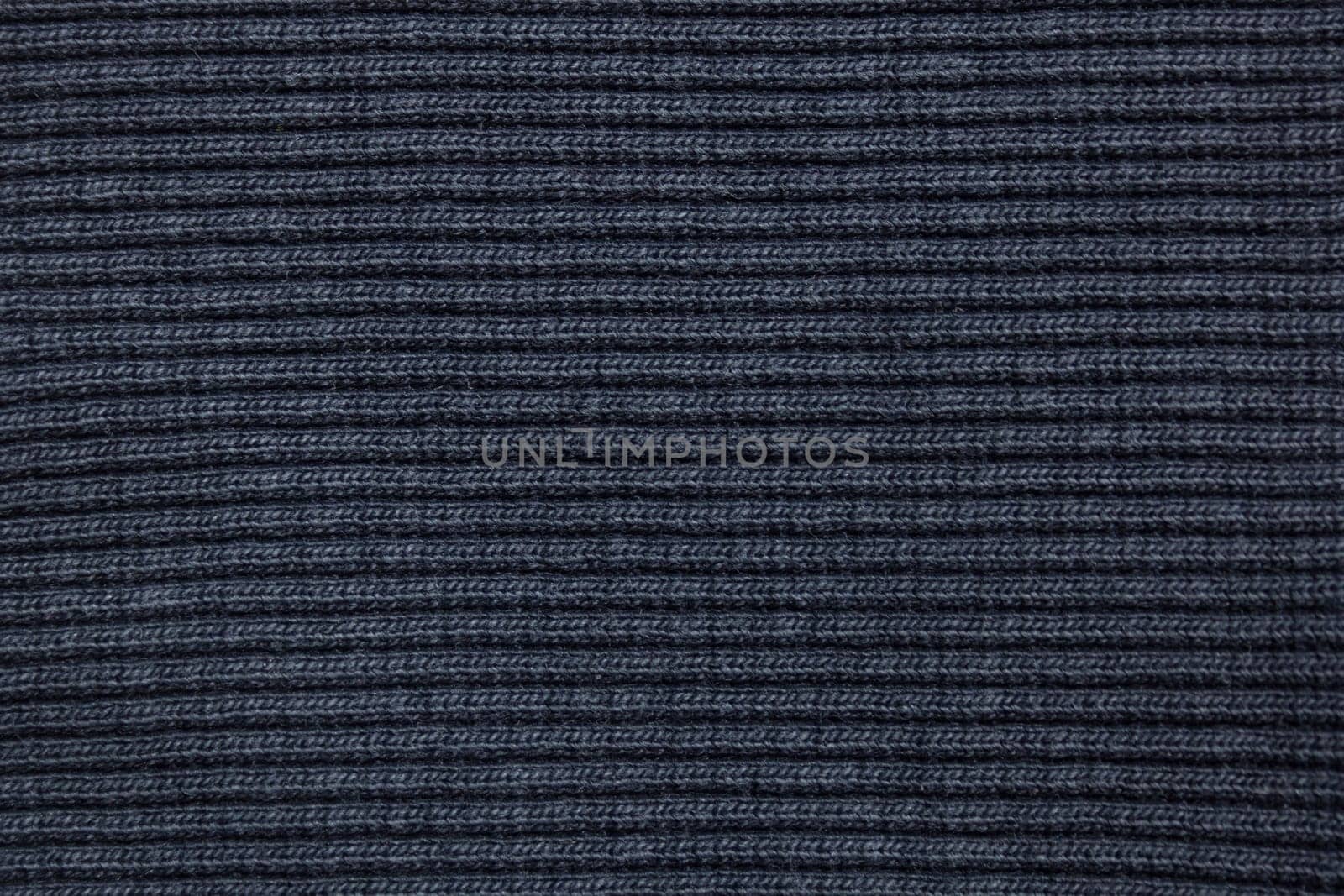 Blue finely knitted fabric background