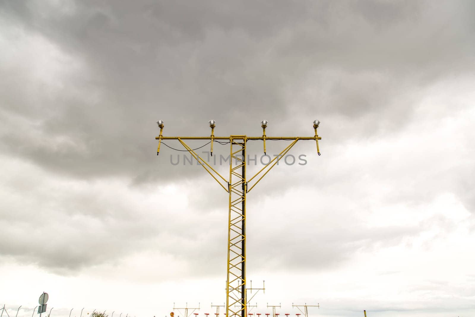 Approach Lighting System with clouds in the background.