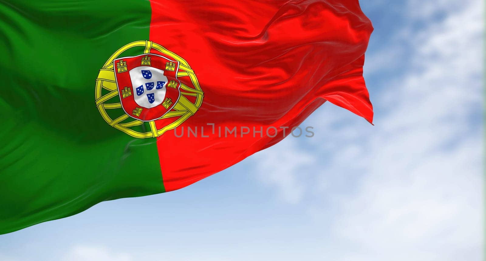 Portugal national flag waving in the wind on a clear day. Portuguese Republic is a Member State of the European Union. Fabric textured background. Selective focus. Realistic 3d illustration