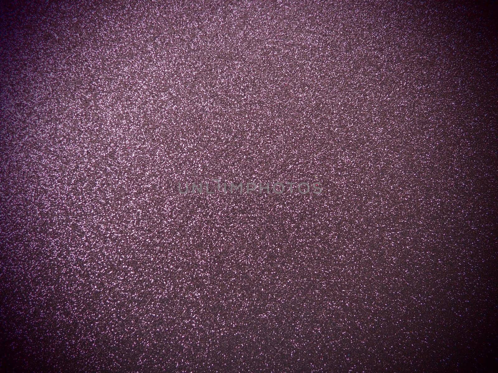 Purple shiny bokeh abstract background. Blue - lilac paper with sparkles. Festive backdrop.