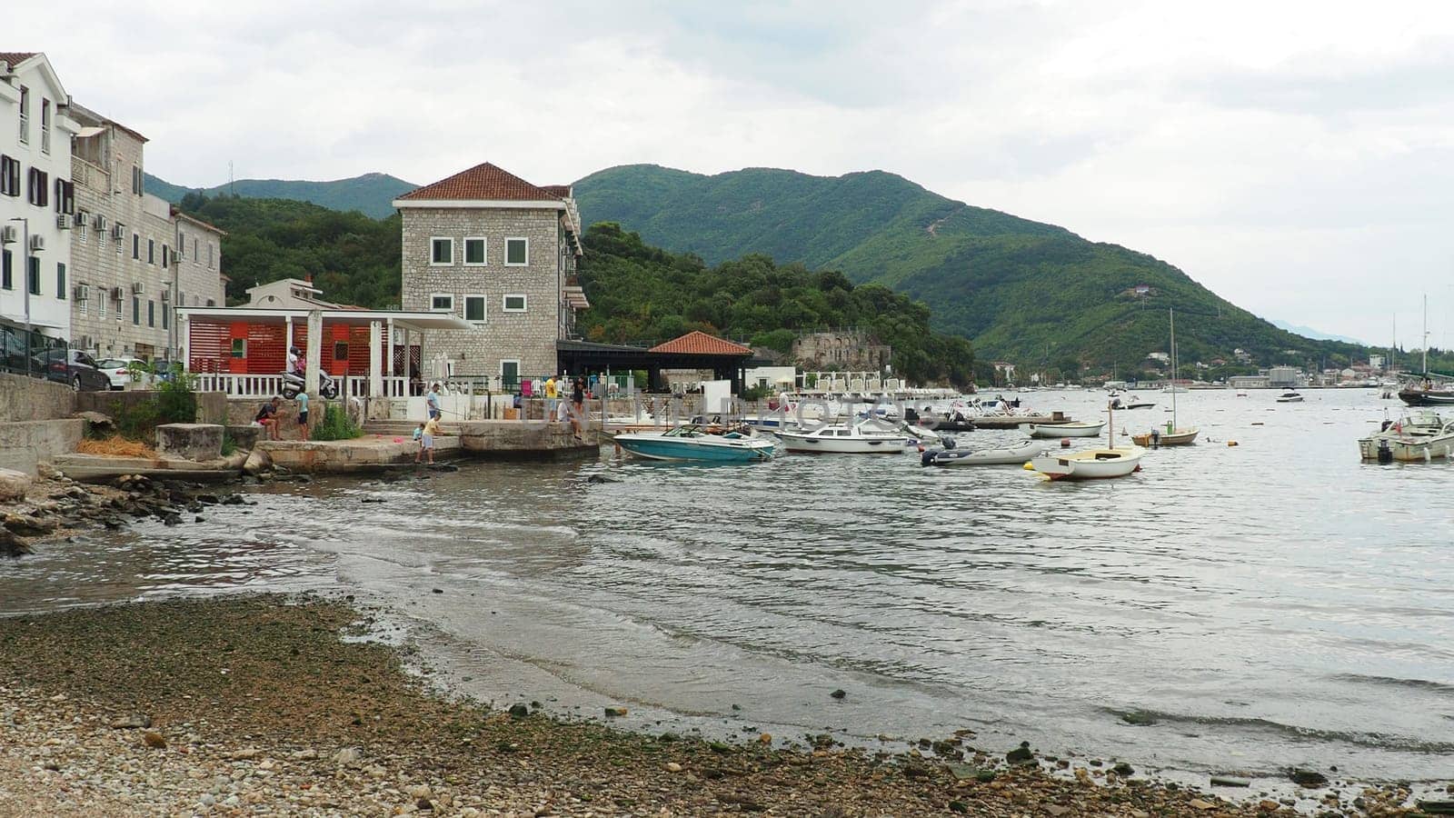 Meljine Herceg Novi, Montenegro, August 12 2022 Boats, yachts and ships are at anchor. Moored ships in the parking lot. Adriatic Sea Mediterranean. Travel business. Sea travel and sports. White boats.