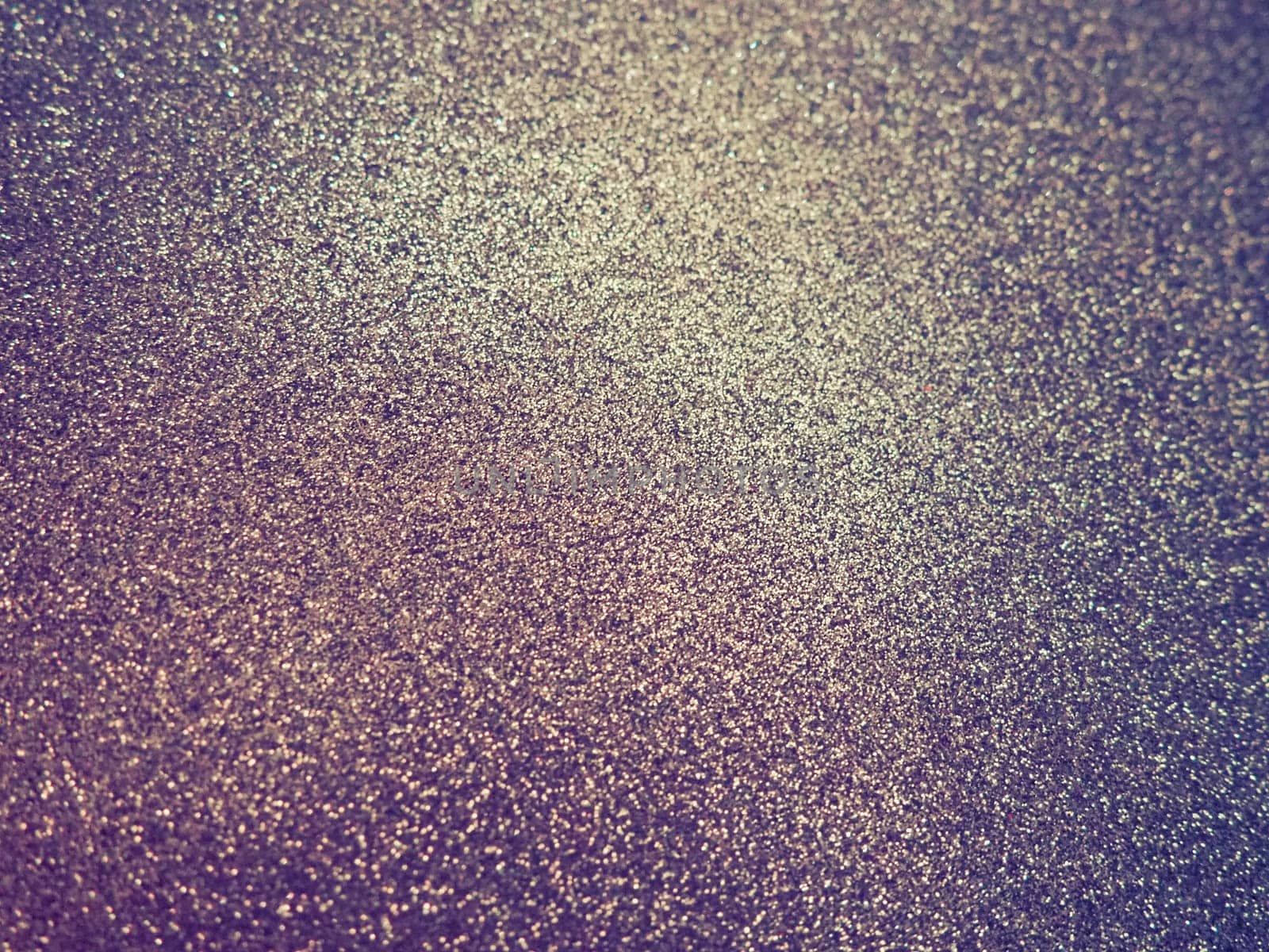 Purple - yellow shiny bokeh abstract background. Blue - lilac -pink paper with sparkles. Festive backdrop.
