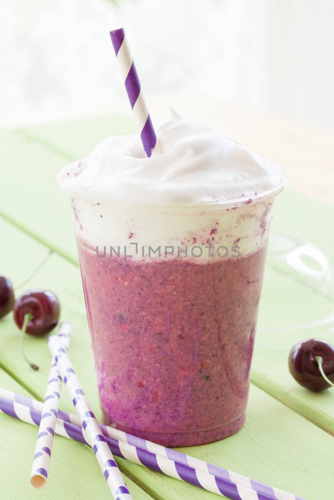 Smoothie from red fruit with whipped cream