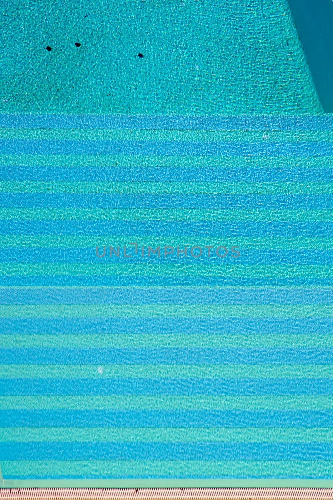 The aerial view and bird's view of a swimming pool in summer.