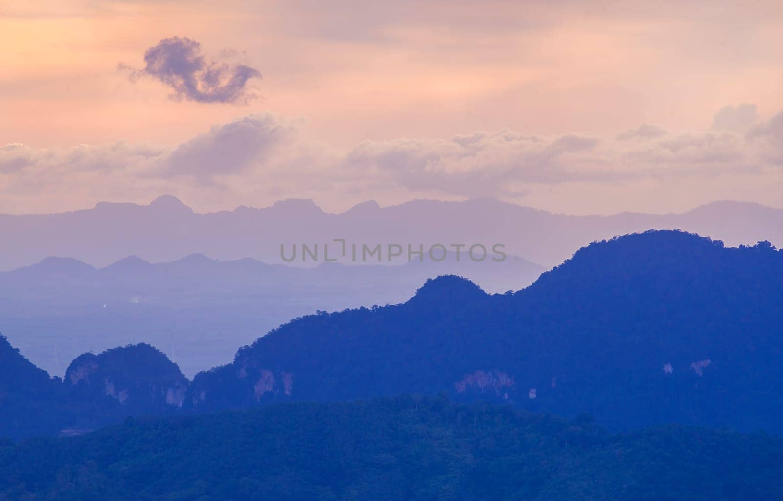 View of landscape nature and mist and mountain with sunlight and sunset or sunrise in morning light, Abstract and pattern of cloud sky Calming coral, Orange, Trend color of the year background