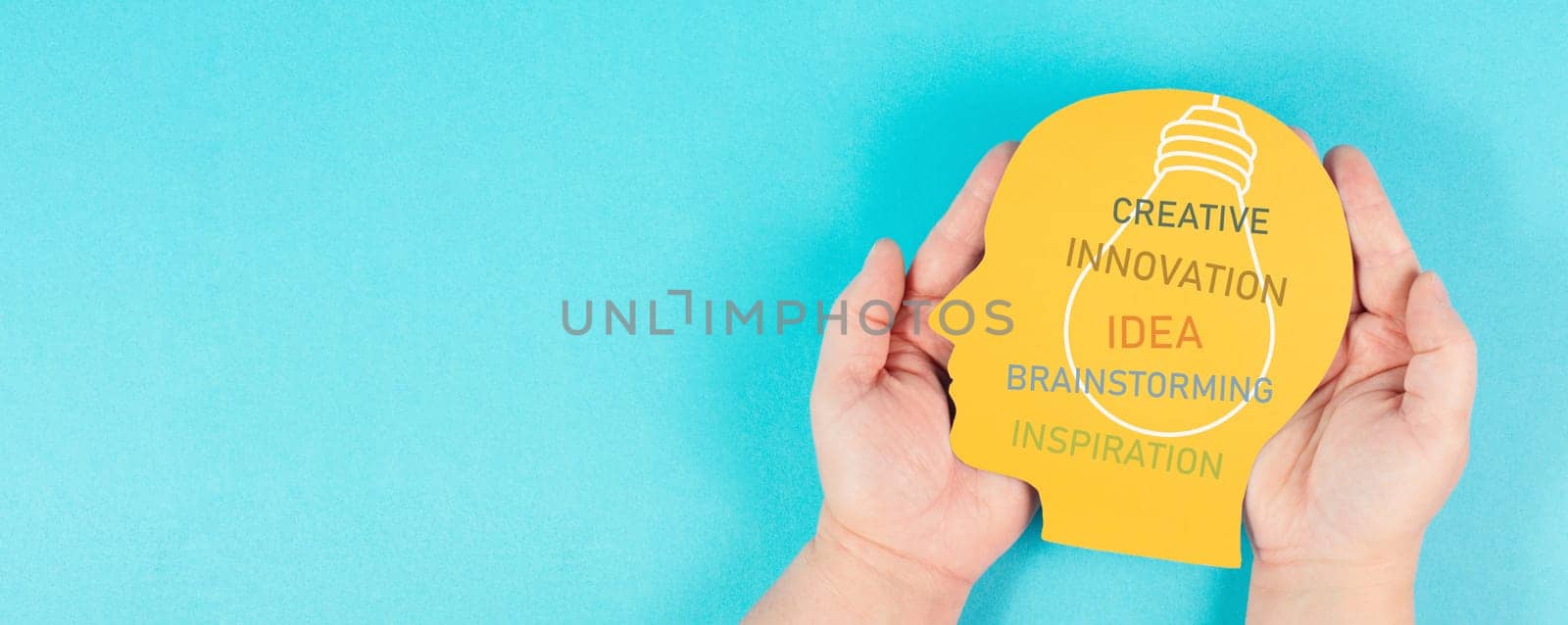 Head with light bulb and words like creative, innovation, brainstorming for an idea, having inspiration, business concept