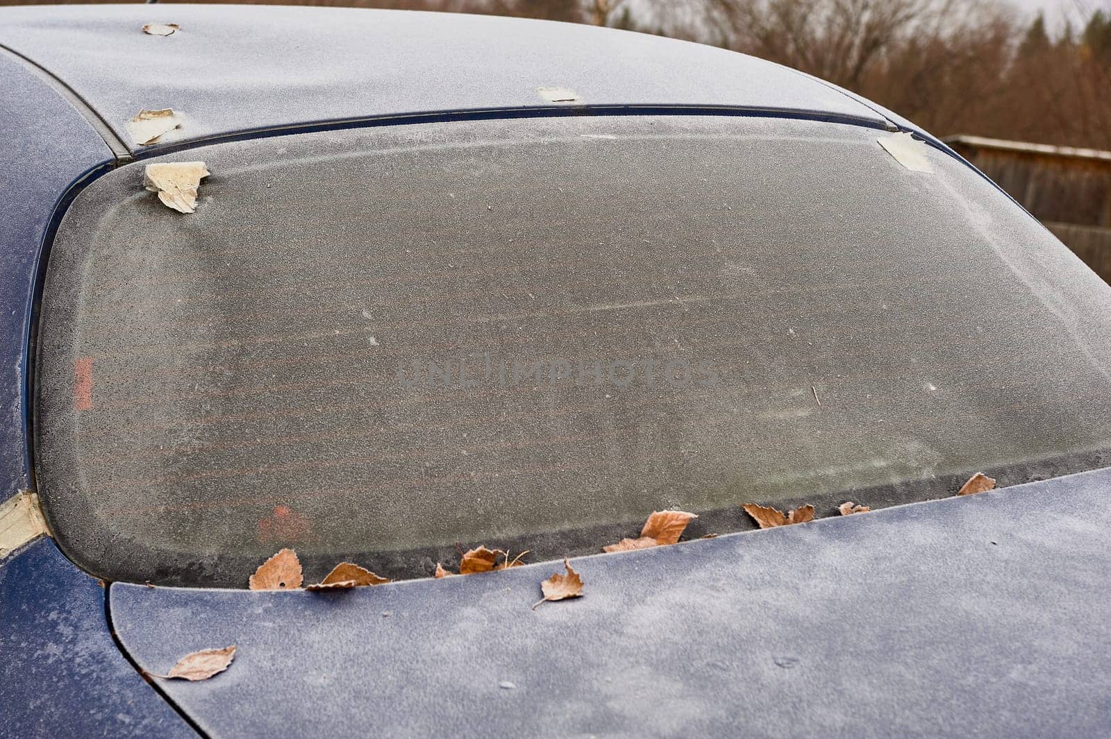 frozen windshield of a passenger car in winter. High quality photo