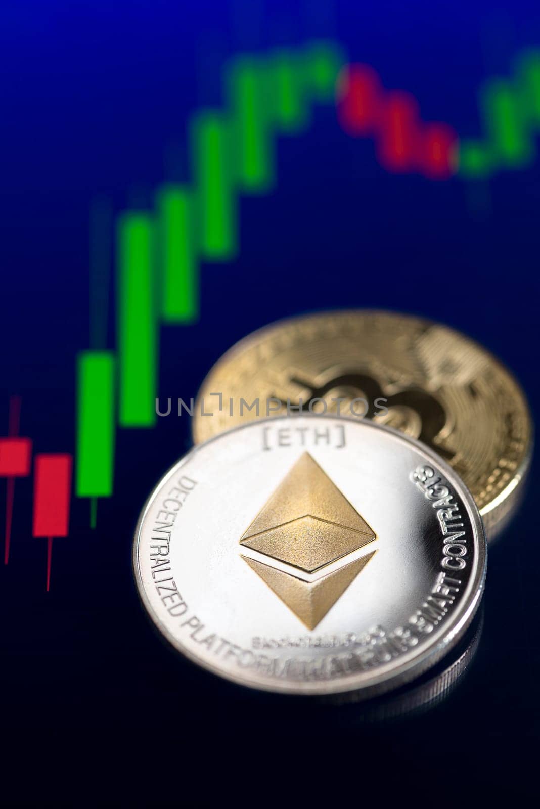 Bitcoin and cryptocurrency investing concept. Bitcoin and ethereum cryptocurrency coins. Trading on the cryptocurrency exchange. Trends in bitcoin exchange rates. Rise and fall charts of bitcoin and altcoin.