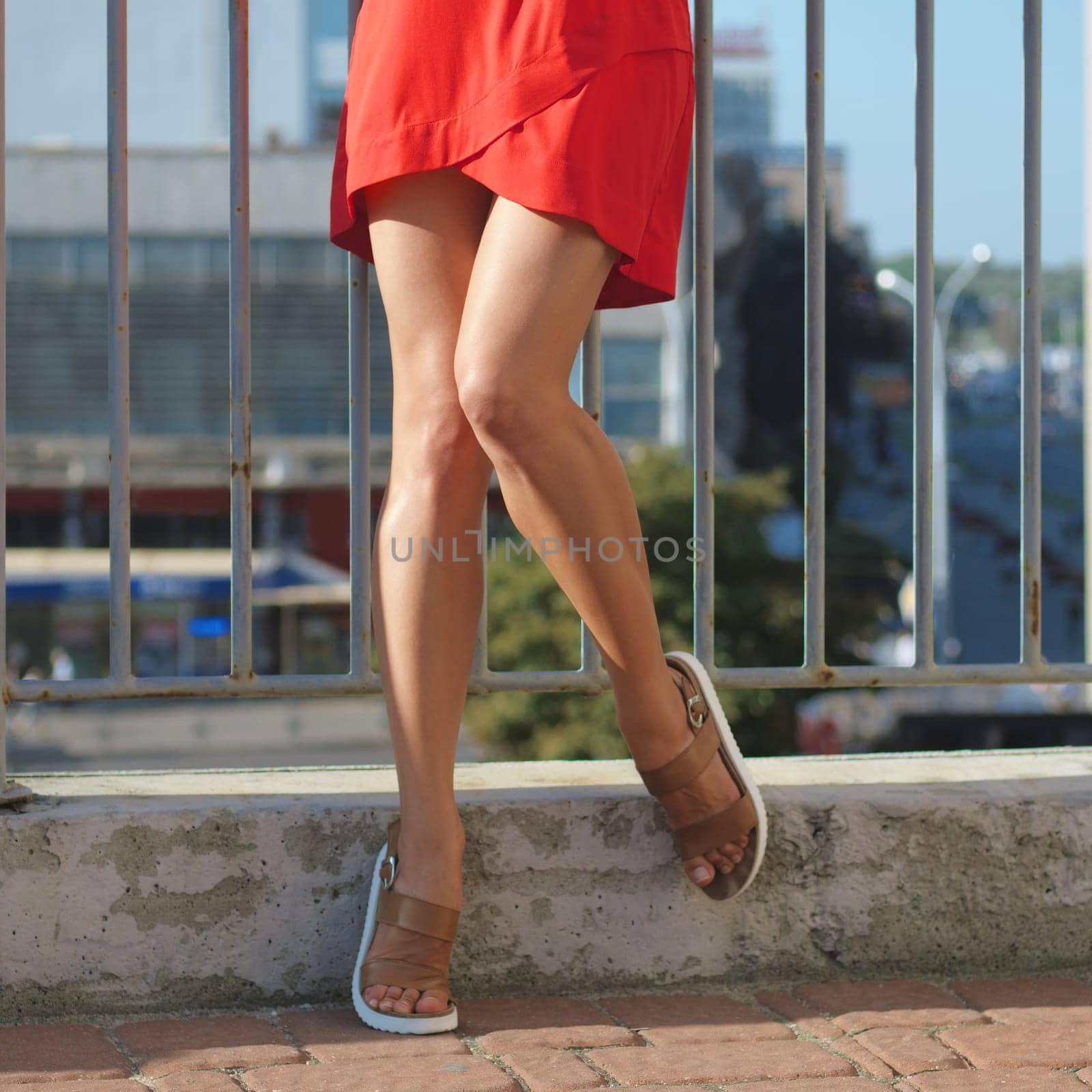 Muscular female legs posing  outdoor.