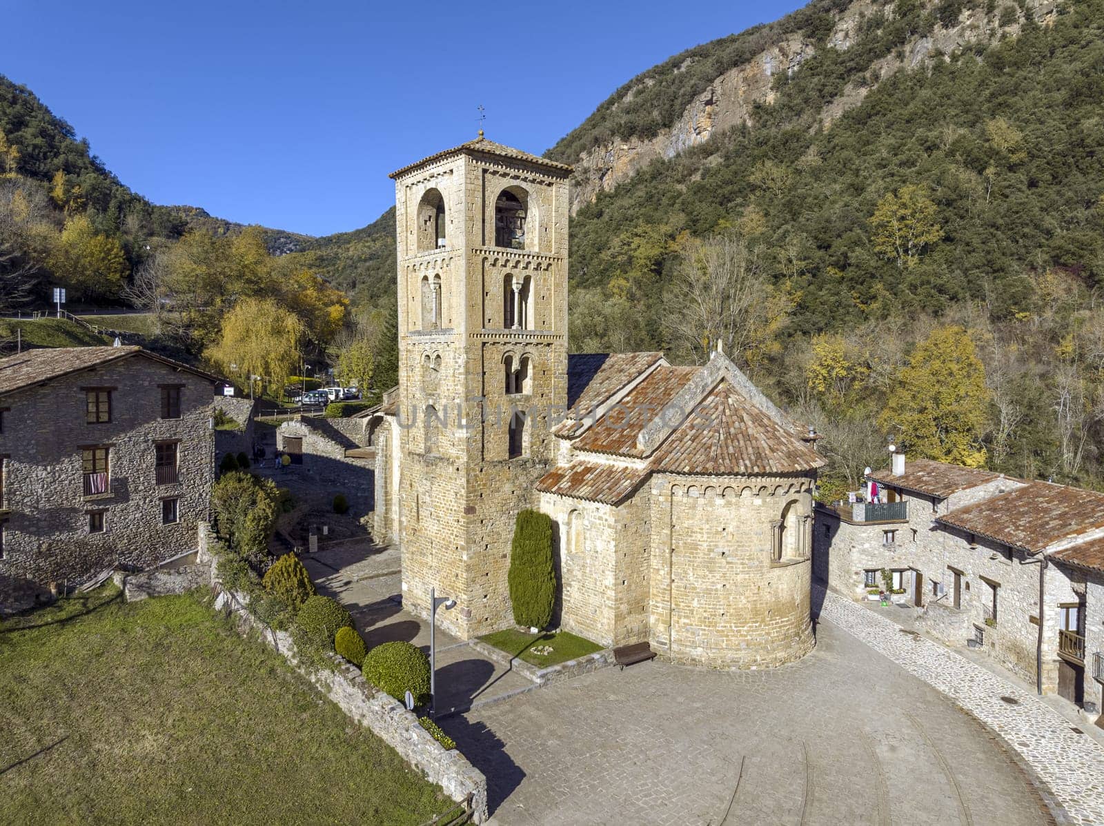 View of the bell tower and the apse of the Romanesque church of Beget,  of Sant Cristofol (12th Century )  Spain
