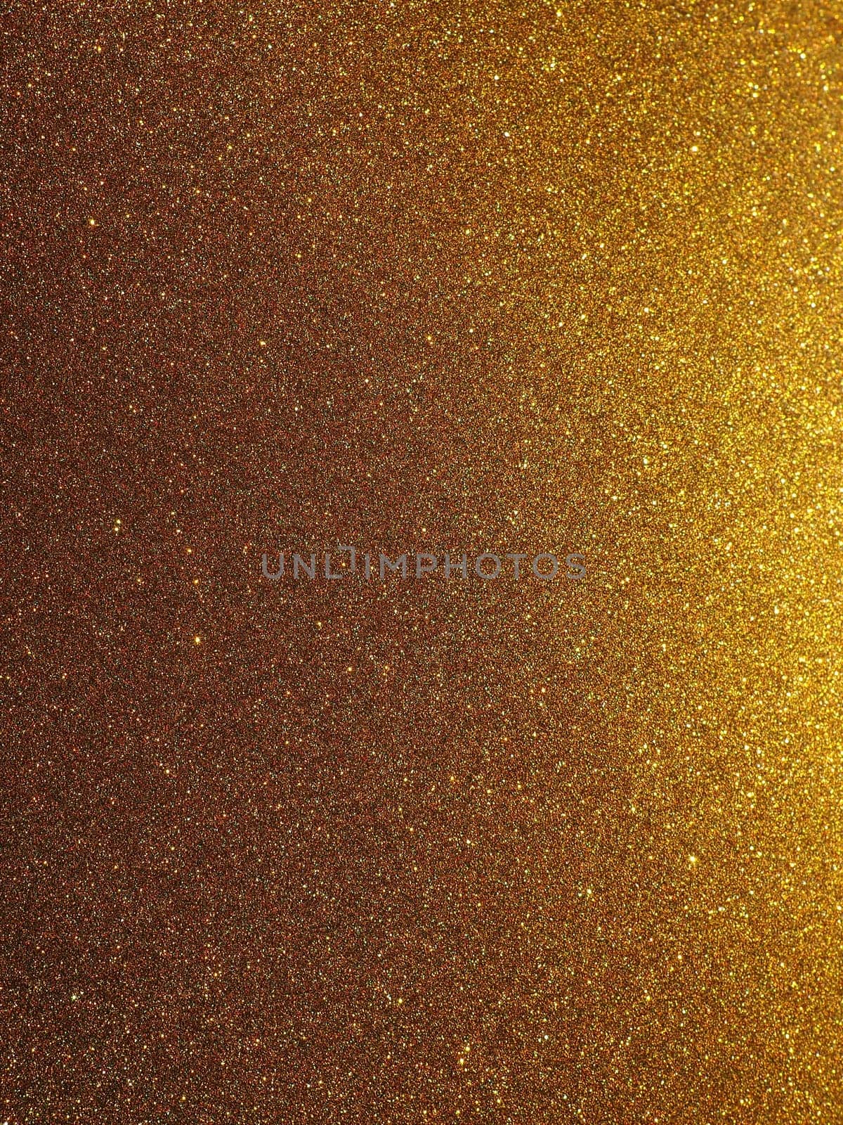 Bokeh light of gold glitters. Golden glitter texture background. Sparkling glitter wrapping paper with sequins and sparkles. Festive golden bokeh and glitter. Beautiful background