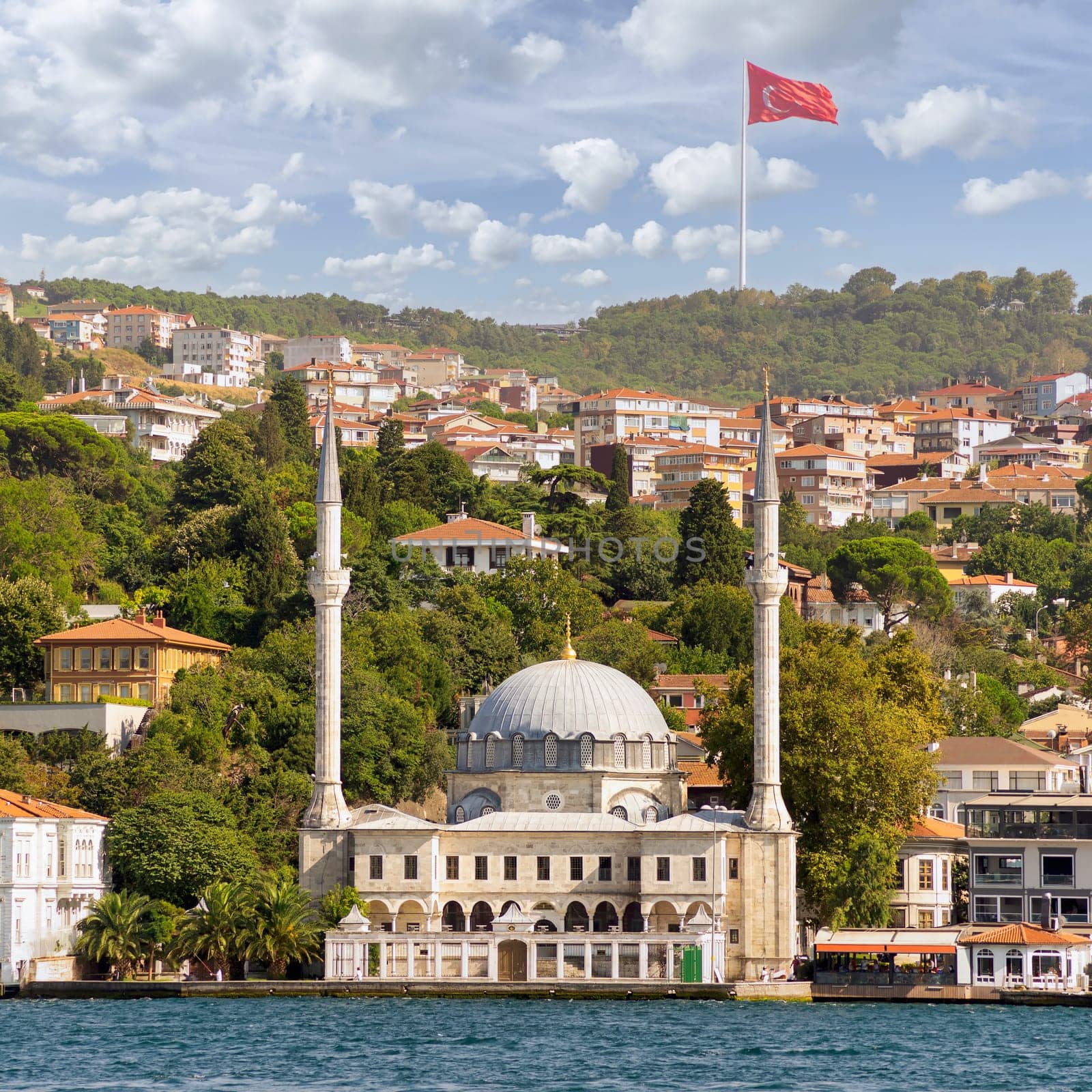 View from Bosphorus Strait overlooking Beylerbeyi Mosque, or Beylerbeyi Camii, aka Hamid i-Evvel Mosque, suited at the waterside of Beylerbeyi district, Istanbul, Turkey