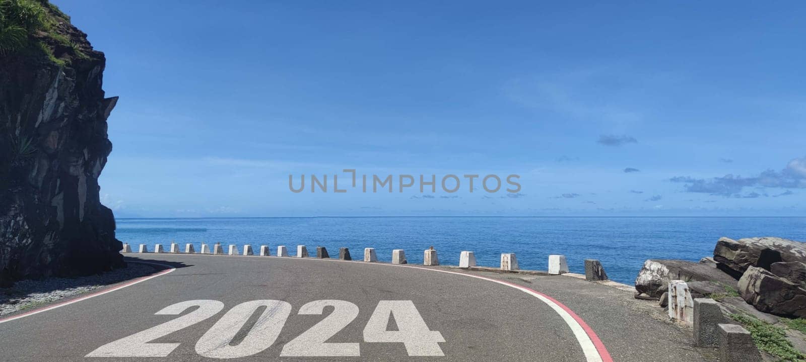 The New year 2024 road to future ahead word on asphalt road