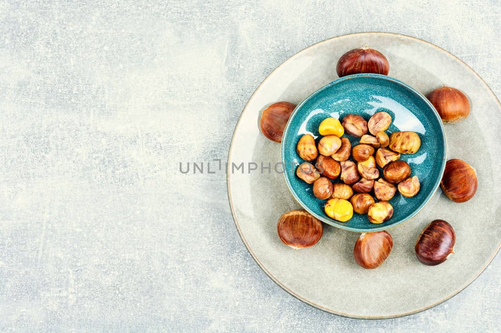 Peeled roasted chestnuts, appetizing dessert. Caramelized roasted chestnuts. Close up
