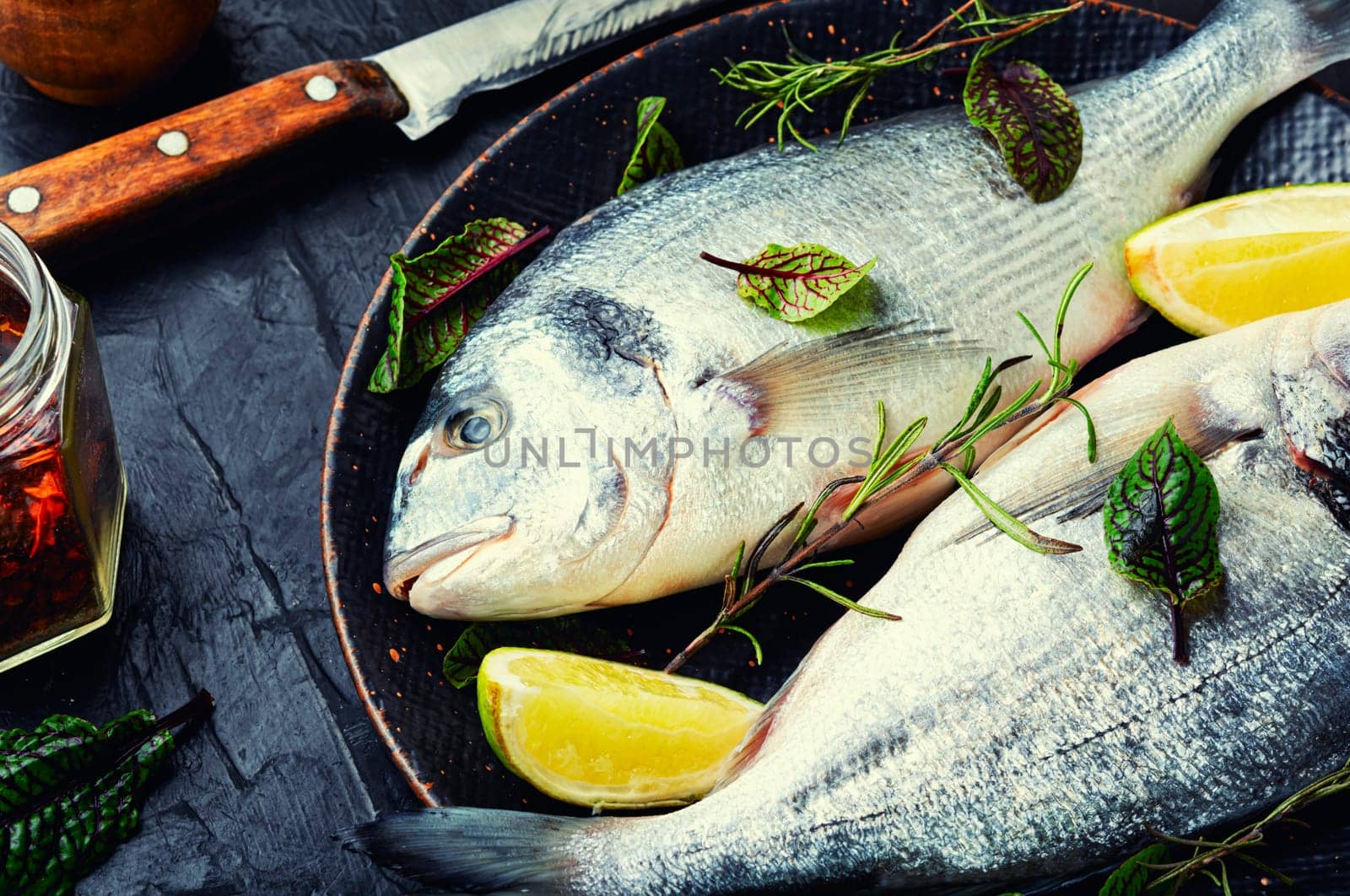 Fresh raw dorado fish for cooking on a plate. Seafood