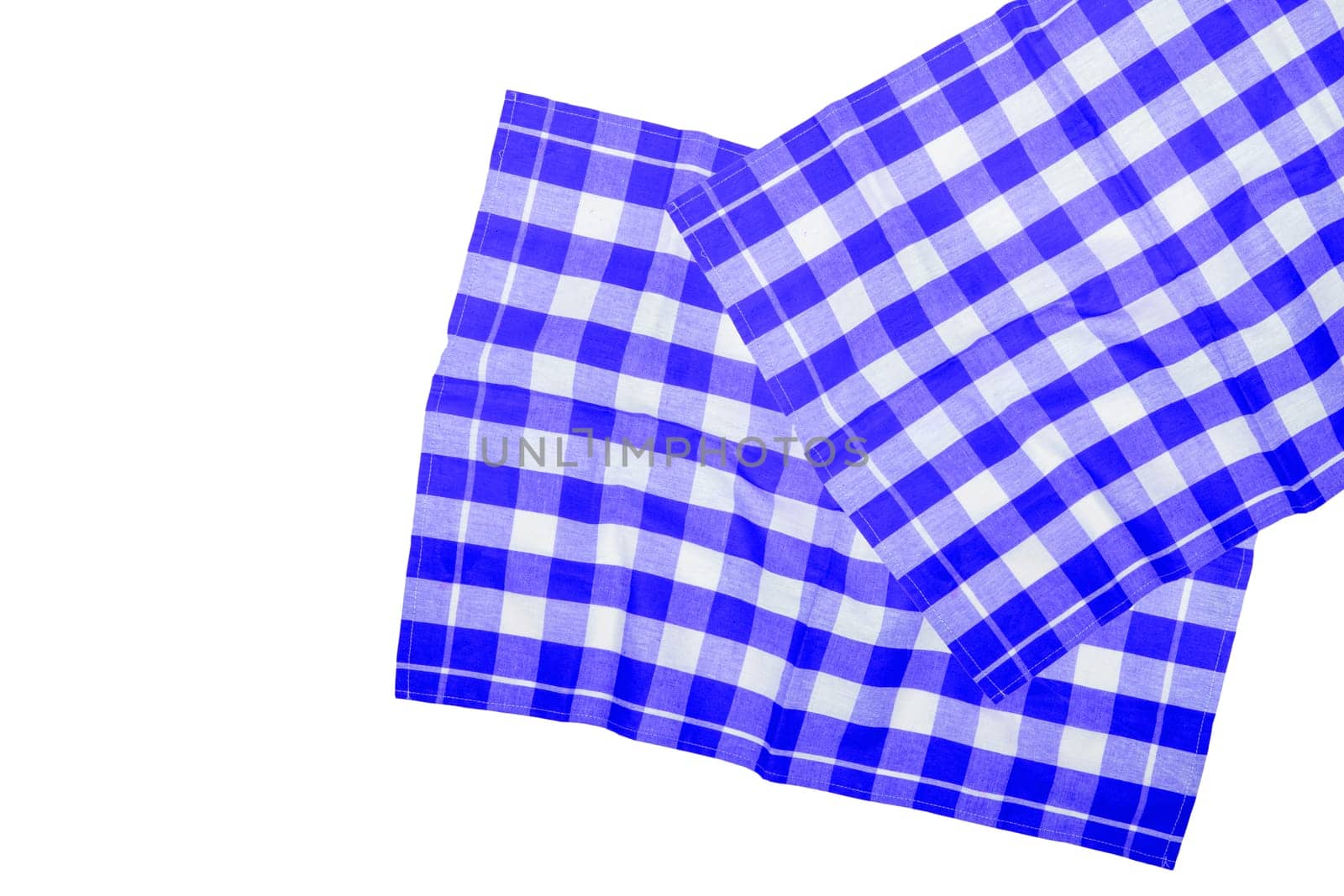 Closeup of a blue white checkered napkin or tablecloth texture isolated on a white background. Clipping path. Kitchen accessories. Top view.