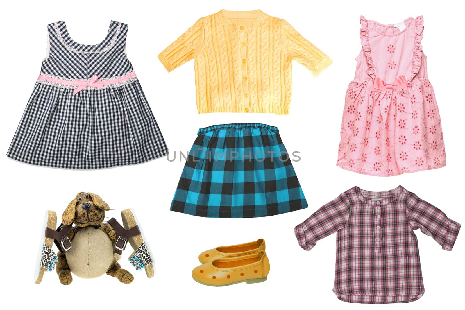 Collage set of little girl summer clothes isolated. The collection of dresses, skirt, sweater, blouse, shoes and a funny dog with sandales. Fashionable kids outfit.