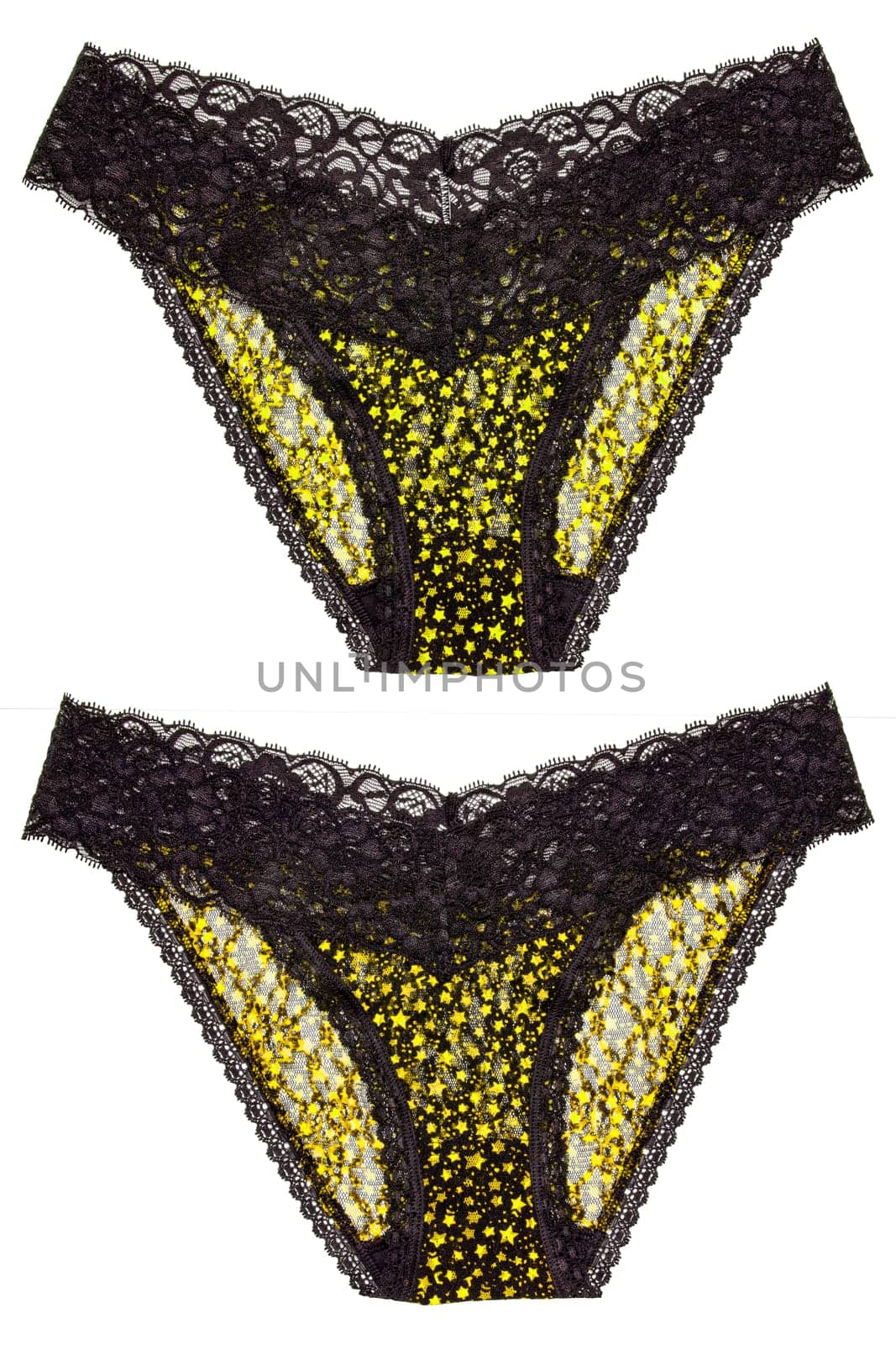 Underwear woman isolated. Set of luxurious elegant black lace thongs panties with colorful yellow stars pattern isolated. Clipping path. Macro. Underwear fashion.Two views.