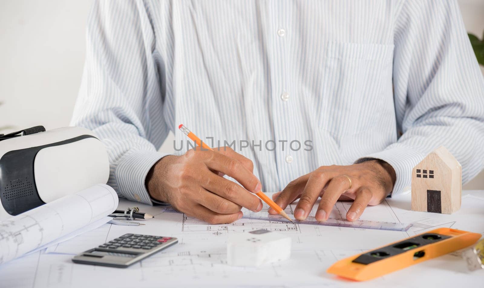 Architect workplace. Architectural building design and construction plans with blueprints paper project plans VR glasses, designing man edit a building or architecture with ruler, technology industry