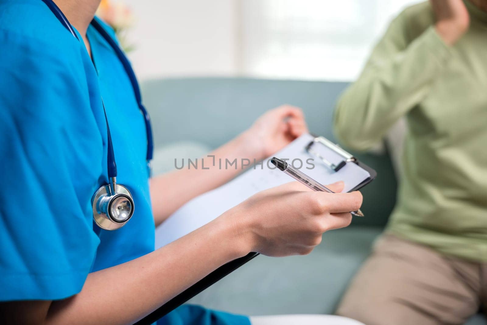 Asian young nurse writing prescription during home visit sick elder old man, Senior man takes doctor at home telling about health complaints, health care and medical concept