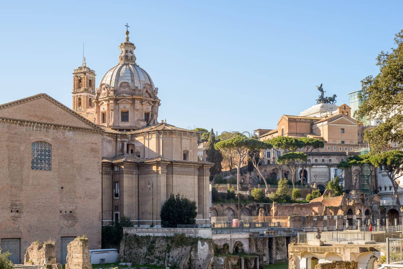Ruins buildings and statue in the foro romano in Rome italy