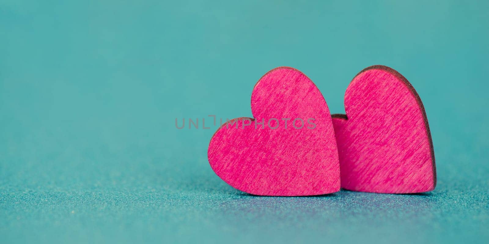Pink hearts on a turqouise background, valentine greeting card, mothers day and birthday wishes, love symbol