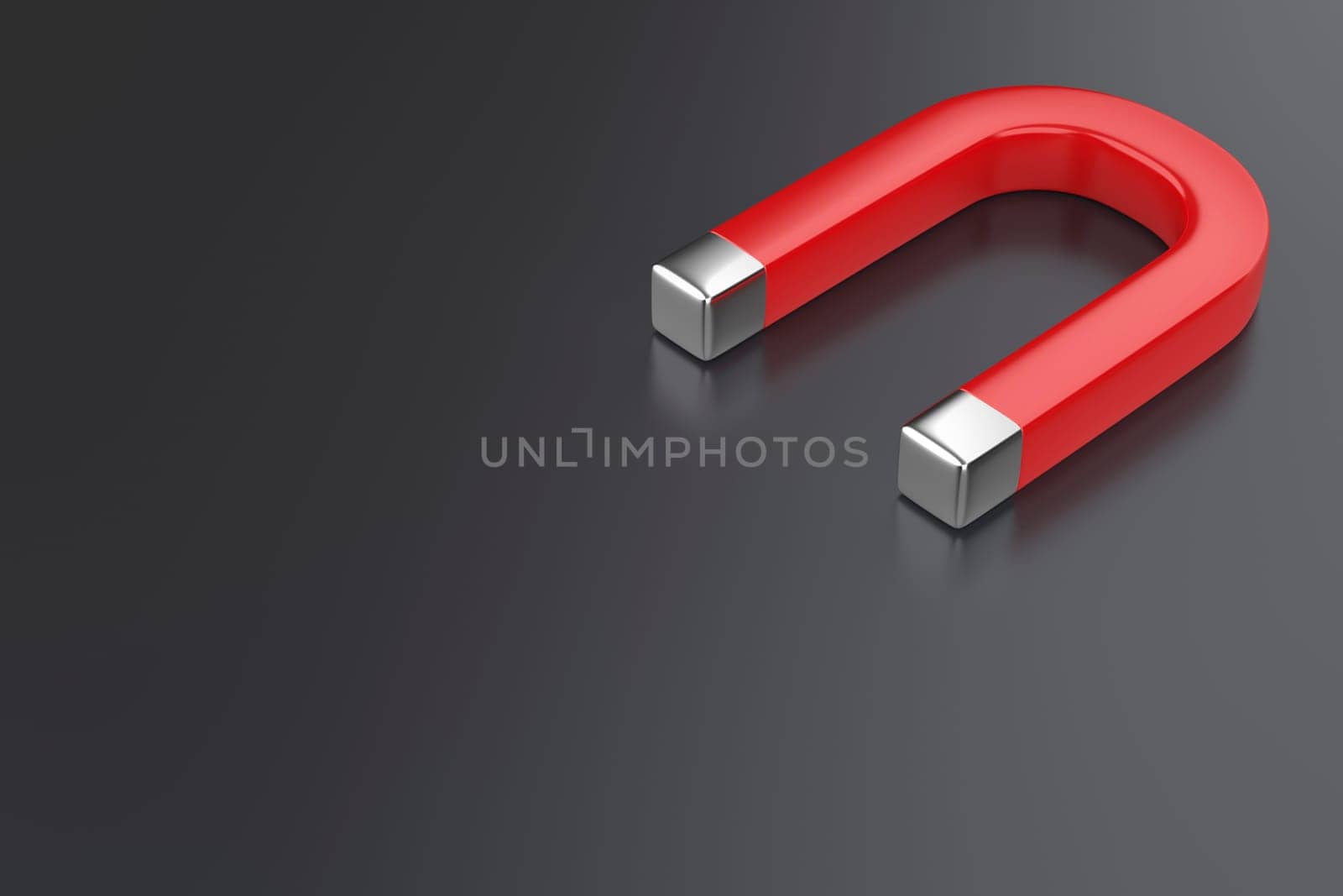 Red horseshoe magnet on dark grey background
