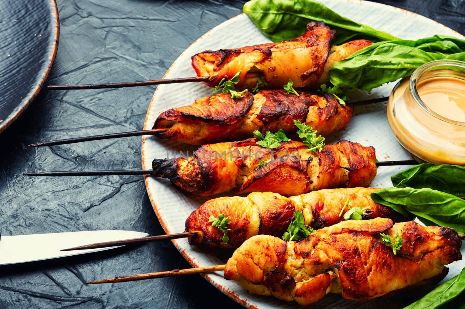 Appetizing chicken meat with peanut butter sauce, chicken breast fried on skewers. Souvlaki