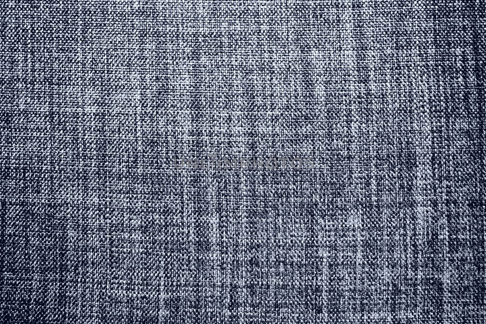 gray background fabric texture. A piece of woolen cloth is neatly laid out on the surface. Weave and textile texture. Dress fabric or for kitchen needs, tablecloth or curtains, close-up. Dash.