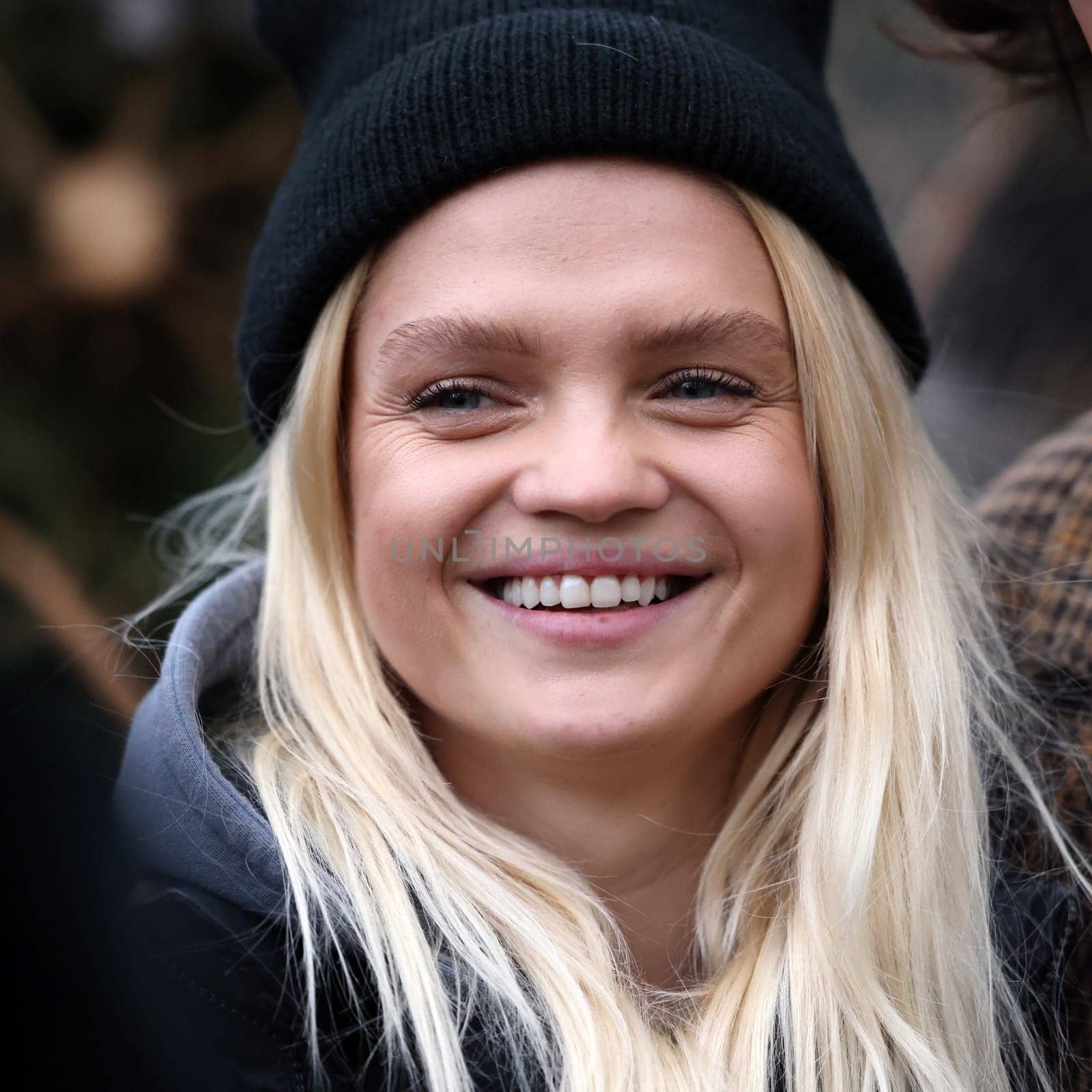 Krakow, Poland - Dec 19, 2021: Margaret during the distribution of Christmas trees at Szczepanski Square in Krakow