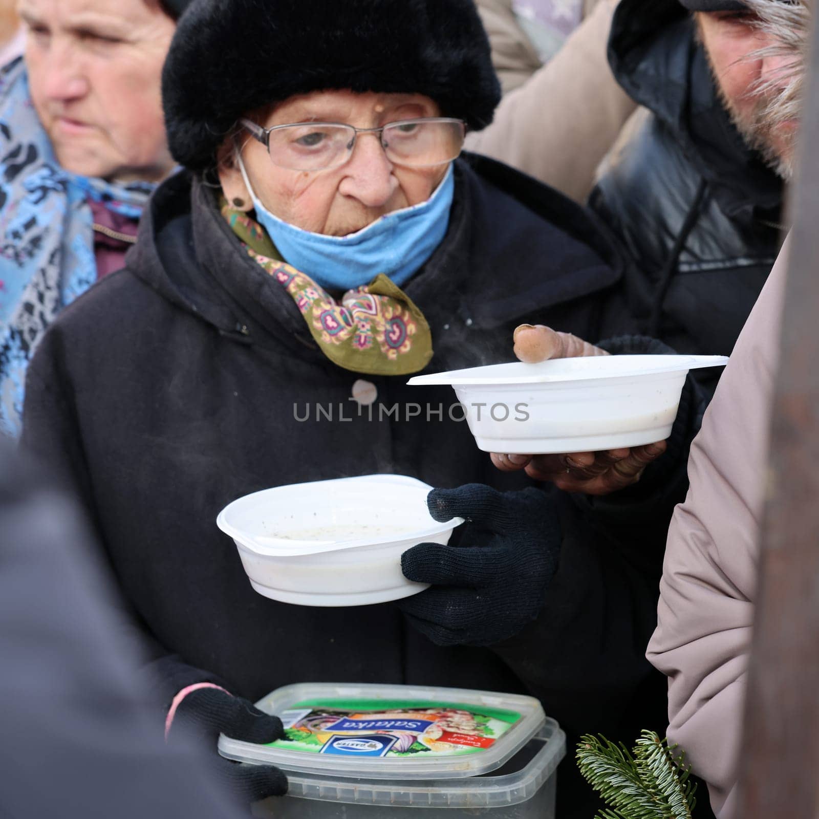 Krakow, Poland - Dec 18, 2022: Christmas Eve for poor and homeless on the Main Square in Cracow. The group Kosciuszko prepares the greatest eve in the open air in Krakow