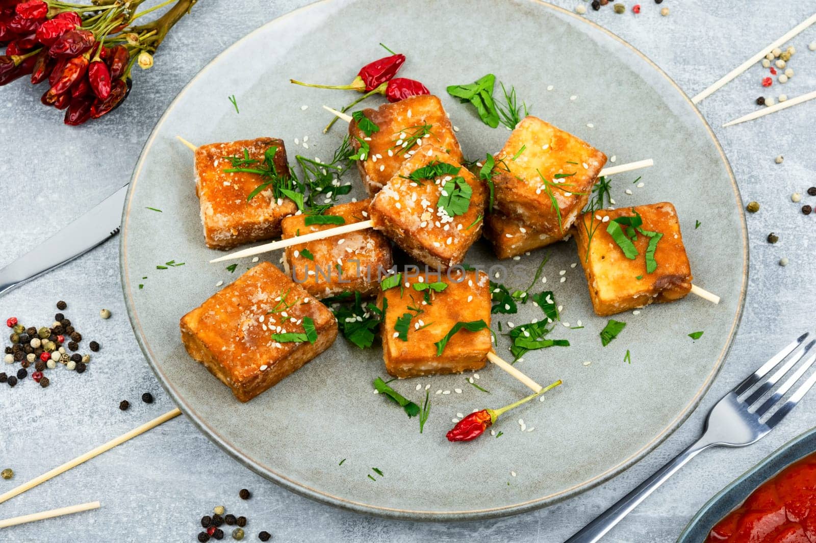 Grilled tofu cheese skewers on the plate. Healthy food