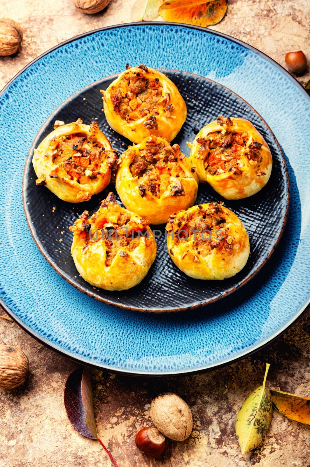 Homemade freshly baked buns with nuts. Fall sweets, autumn dessert